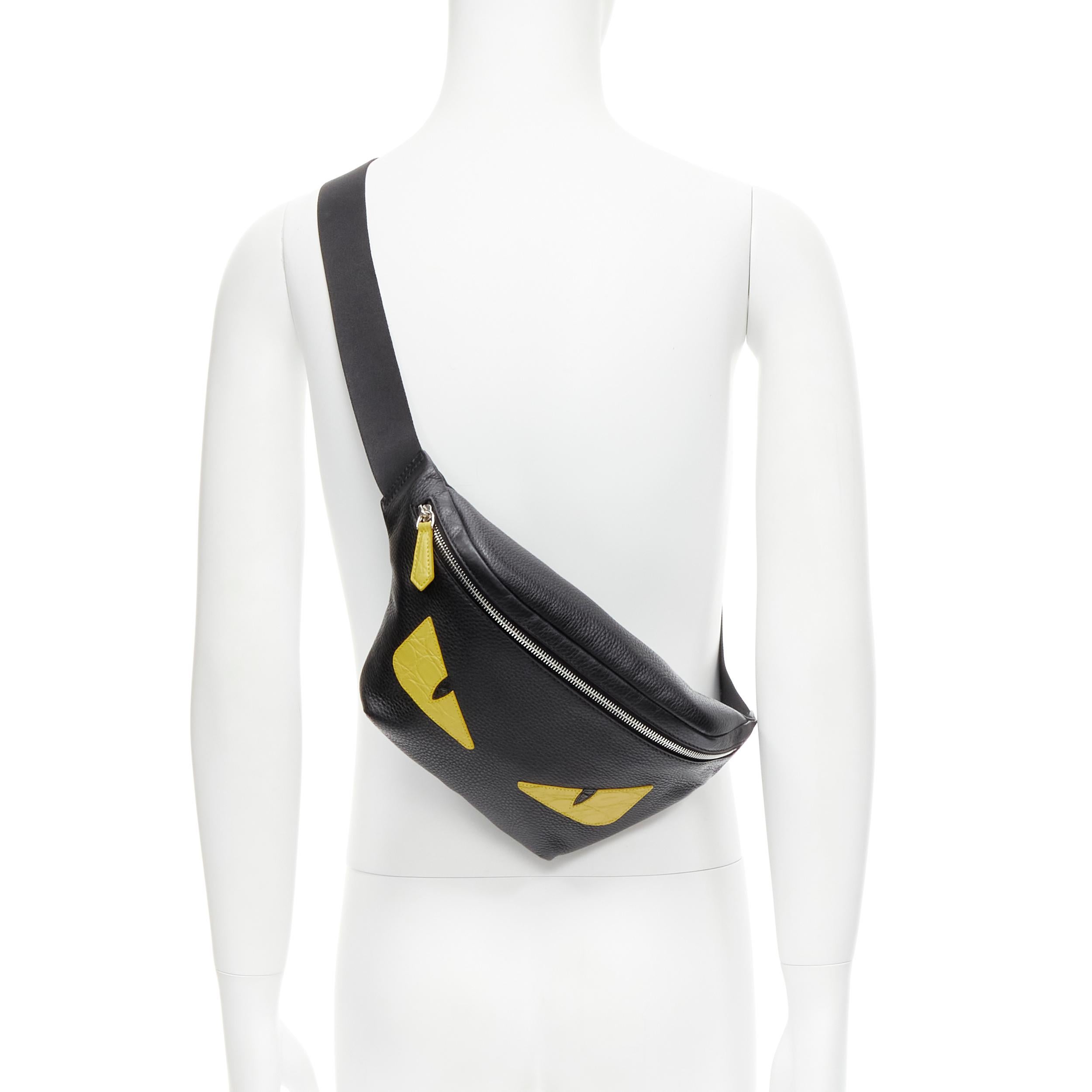 new FENDI Monster Eye black yellow Caiman eye crossbody waist bag 
Reference: TGAS/C00724 
Brand: Fendi 
Model: 7VA434 ADLN F0R2A15 
Collection: Monster 
Material: Leather 
Color: Black 
Pattern: Solid 
Closure: Zip 
Extra Detail: Caiman leather
