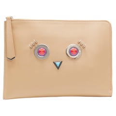 new FENDI Monster Faces tan brown stud embellished zip around pouch clutch bag