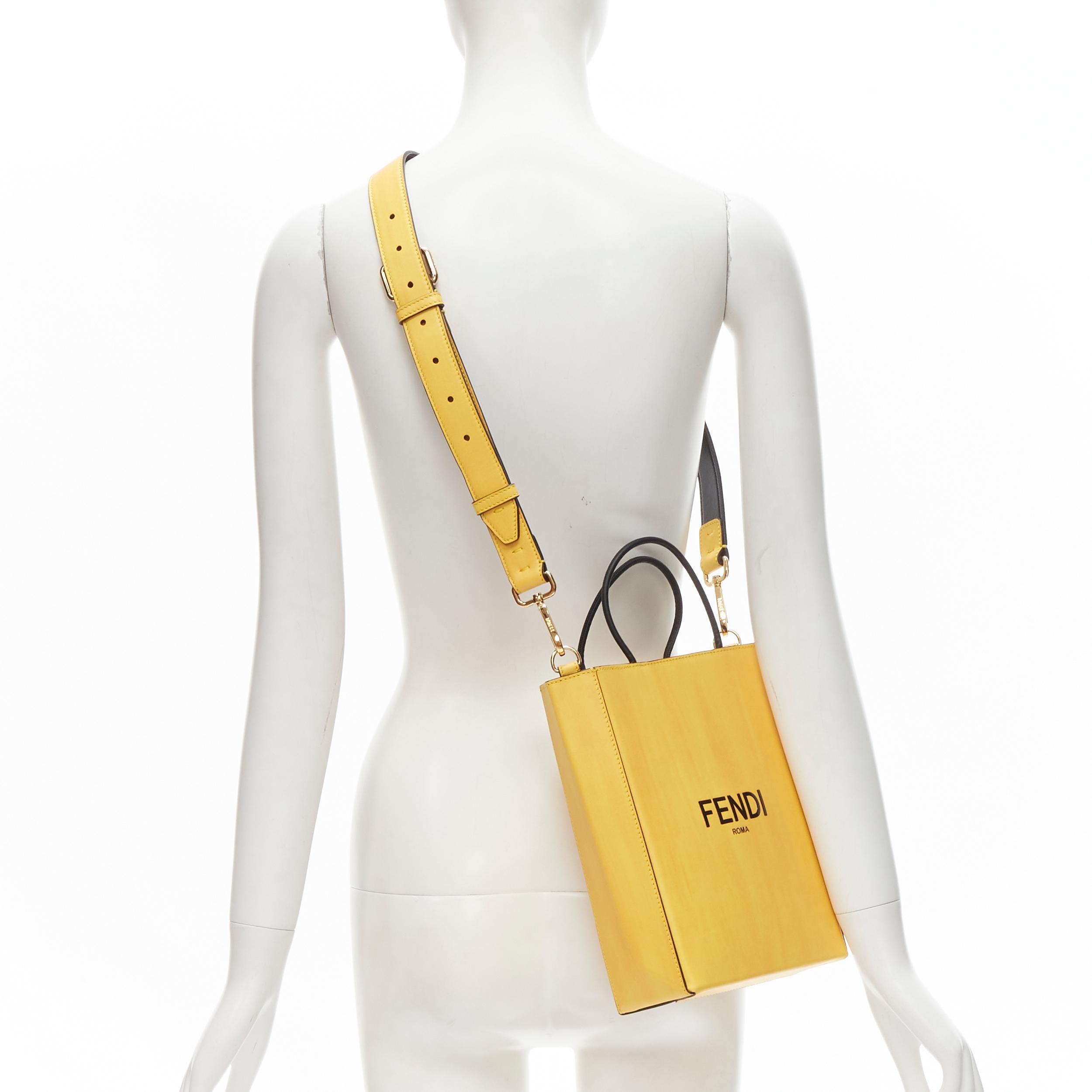 new FENDI Pack Small Shopping yellow leather logo print crossbody tote bag 
Reference: ANWU/A00027 
Brand: Fendi 
Collection: Fendi Pack Runway 
Material: Leather 
Color: Yellow 
Pattern: Solid 
Closure: Magnet 
Extra Detail: Leather tote inspired