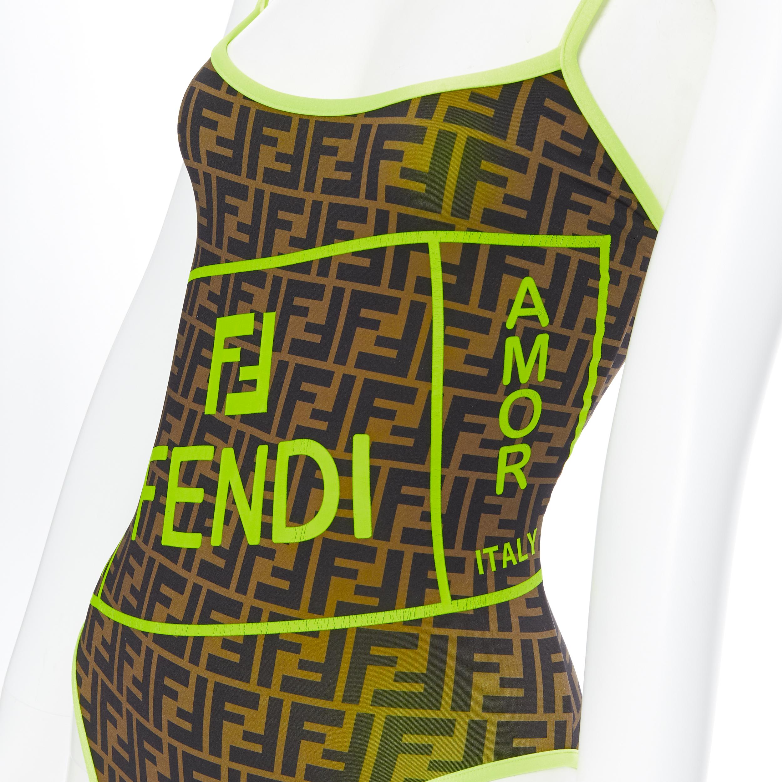 new FENDI Roma Amor brown Zucca neon yellow trimmed one piece swimsuit IT36
Brand: Fendi
Collection: 2019
Model Name / Style: One piece swimsuit
Material: Polyester blend
Color: Brown, yellow
Pattern: Abstract
Extra Detail: Neon yellow trimming.