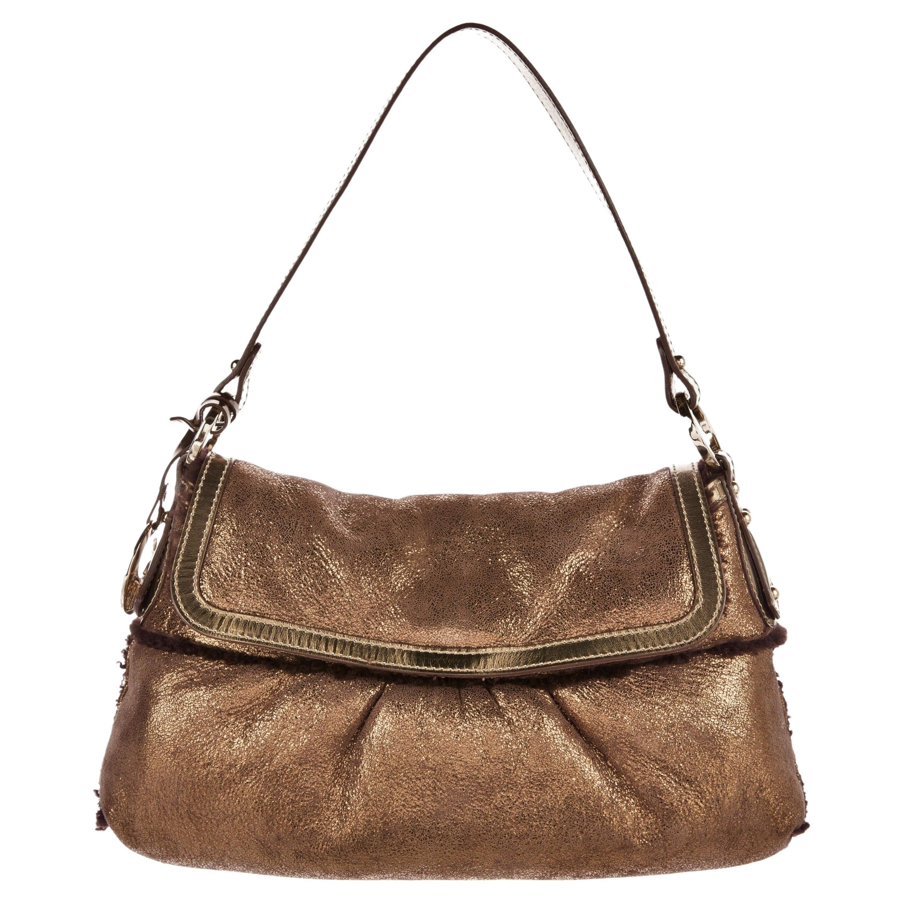 Fendi Shearling Chef Baguette
Brand New
* Shearling Wool Lined & Shearling Accents
* Foil Leather (Finished with a Film of Metal)
* Fendi Gold Hardware
* Detachable Fendi Dangle Charm
* Measures: 12