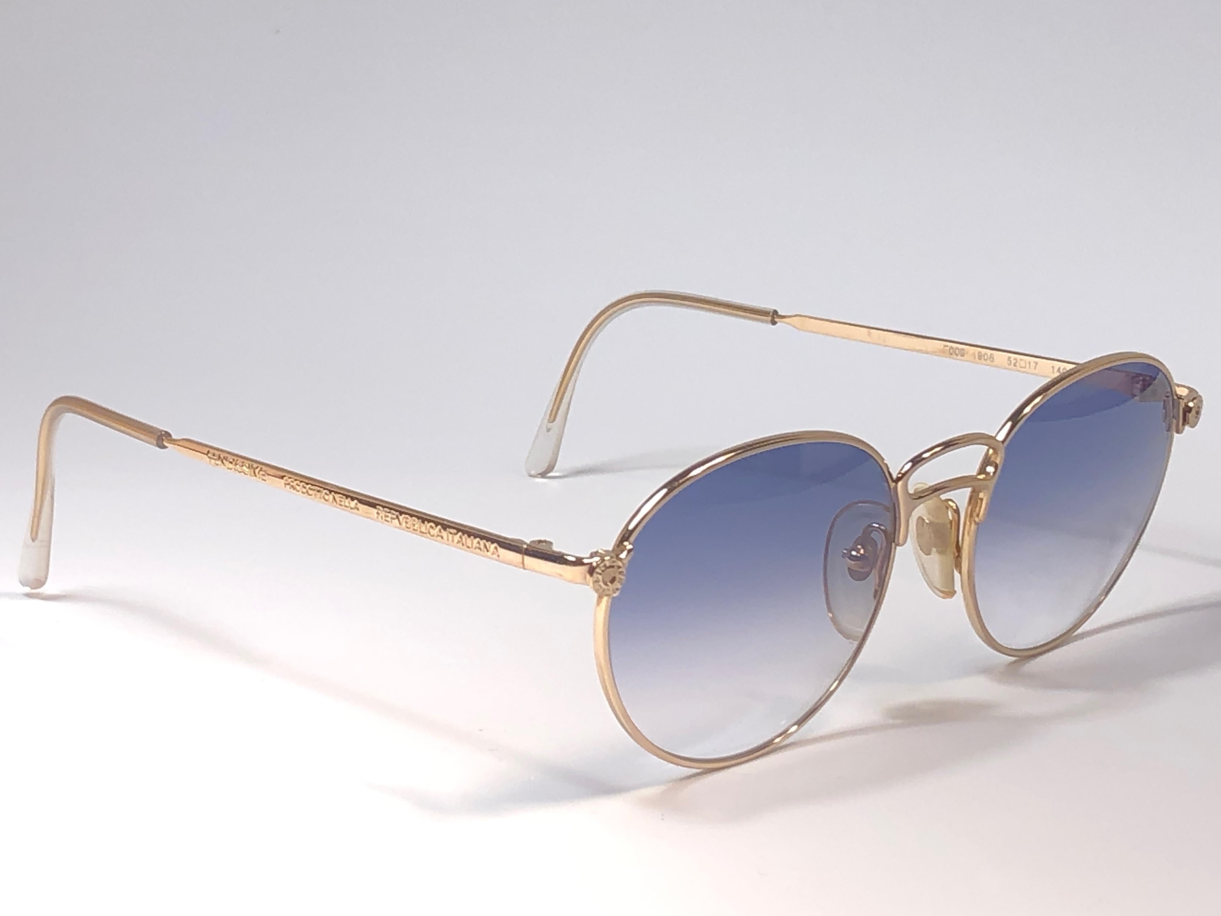 New Fendissime gold frame. 
Spotless light blue lenses.

Amazing design with strong yet intricate details.
Design and produced in the 1990's.
New, never worn or displayed.
A true fashion statement.
