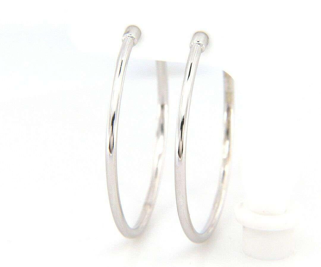 New From Gabriel & Co: 30mm Screw Back Hoop Earrings in 14kt White Gold

Gabriel & Co.
Contemporary Collection
Screw Back Hoop Earrings
Earrings Length: 30.00mm
14kt White Gold
Total Weight: 3.50 Grams
Signed: Gabriel & Co., 14K

Condition:
Offered