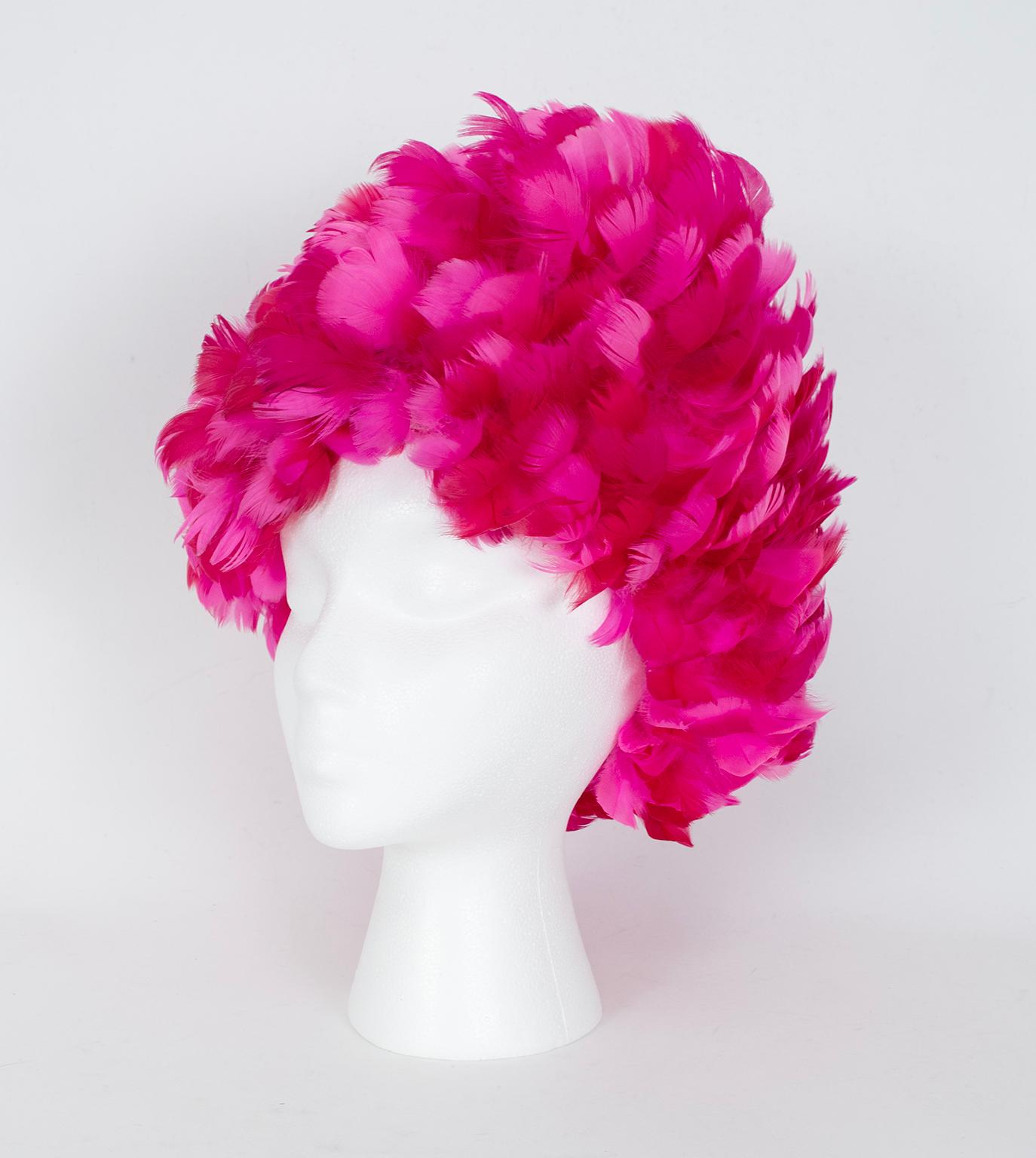 When flamboyance is required, look no further than a turban of hot pink feathers.  Constructed like an elastic shower cap, when stuffed it can reach a height of nearly a foot.  Who knows what you’ll walk out with beneath it?

Elastic hairnet-style