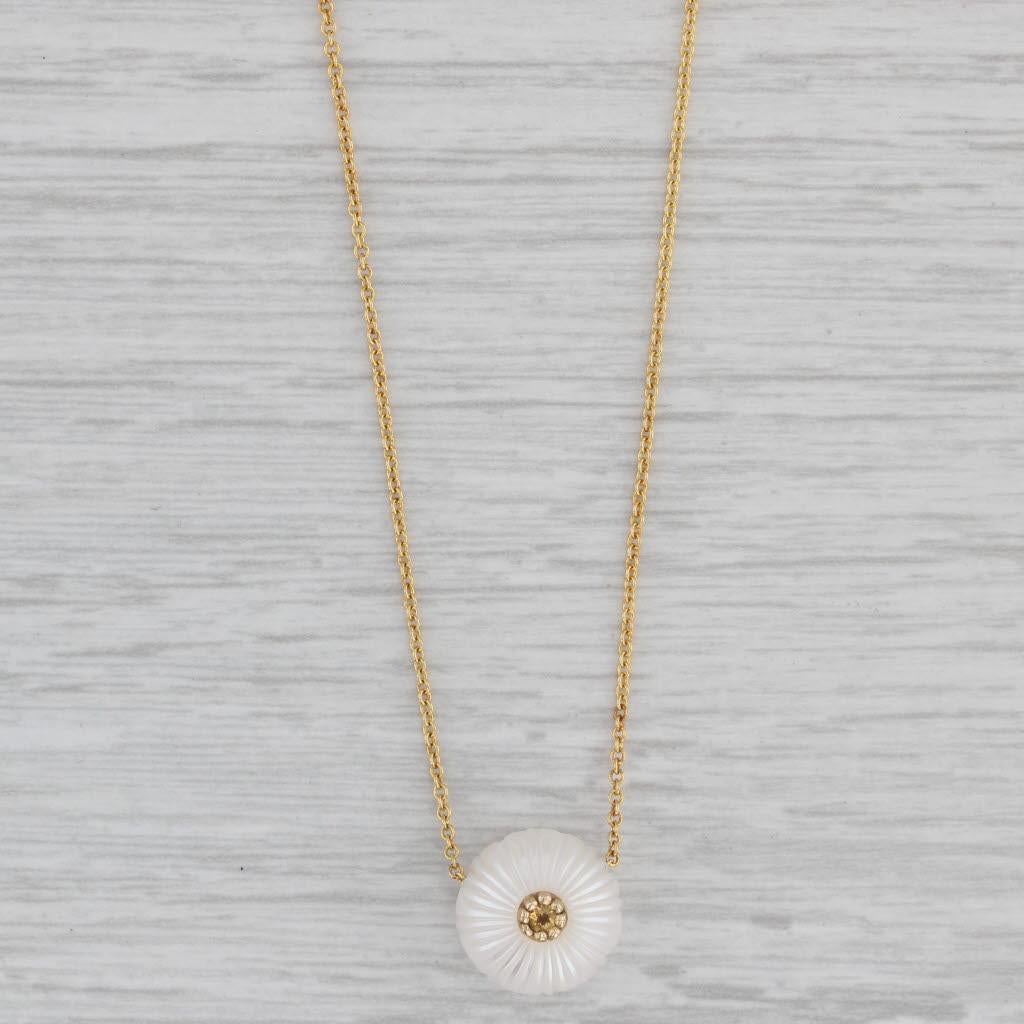 This beautiful set has a pearl pendant displayed on a yellow gold cable chain. One side of the pearl is carved with a chrysanthemum flower design accented by a citrine centerpiece. This lovely piece has a retail value of $500 so don't pass up this
