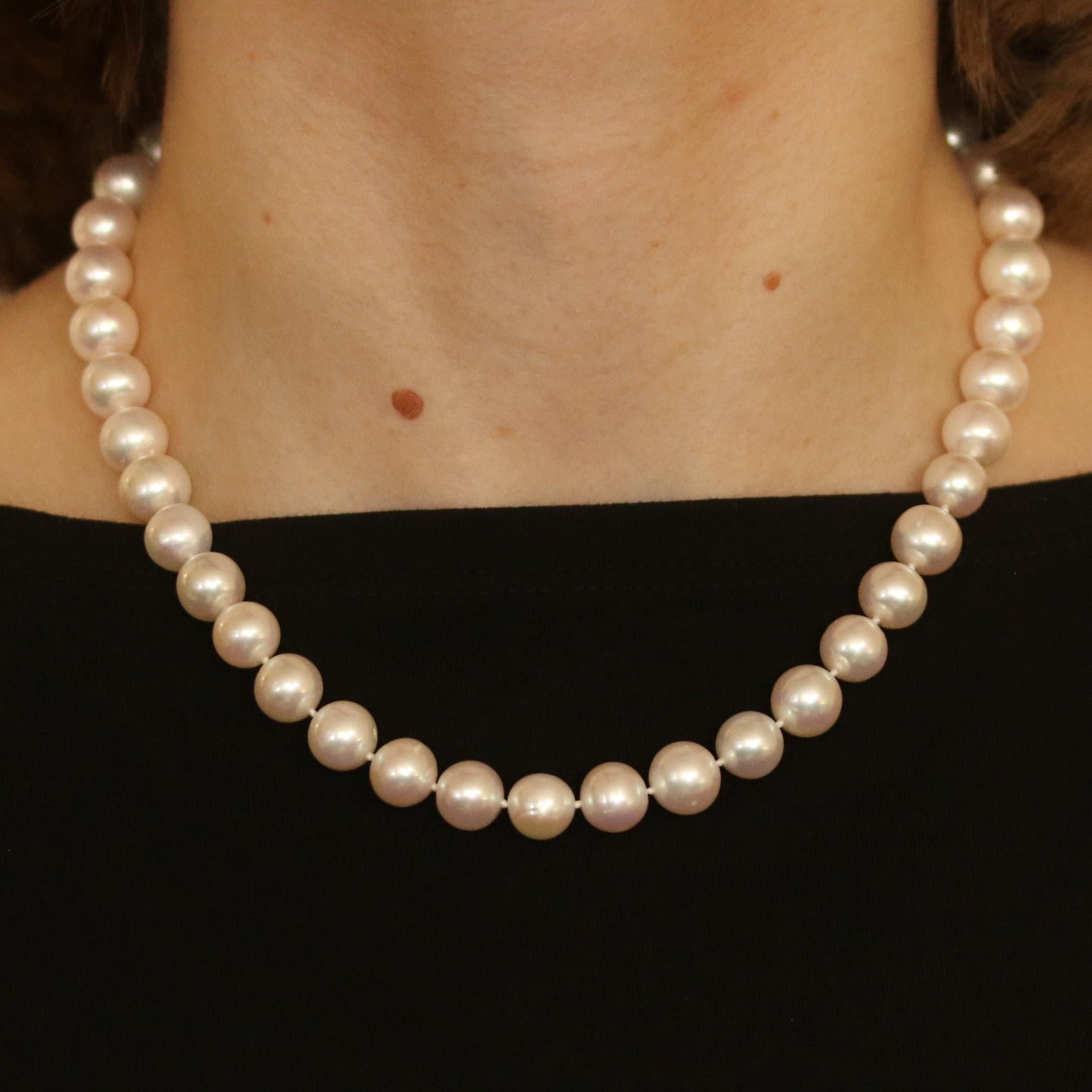 Add a touch of class to any outfit with this beautiful pearl strand necklace. The classic pearl necklace is set with genuine large round white pearls with an average size of 10mm. The pearls are set along a white string strand with knots between