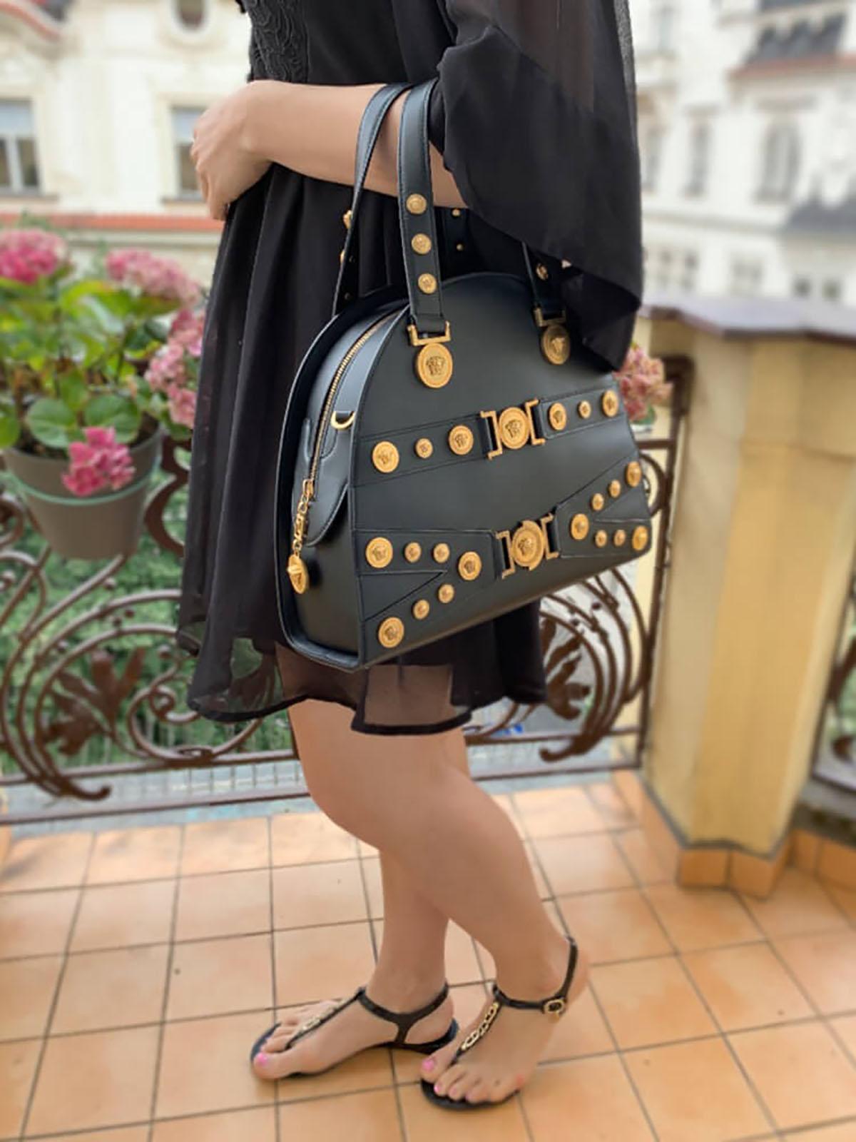 VERSACE 

GIANNI VERSACE TRIBUTE BLACK LEATHER MEDALLION BAG

Versace is one of the most renowned Italian fashion labels. 

Its first boutique was opened in Milan in 1978 and the name Versace quickly became a synonym for luxury and refined taste.
