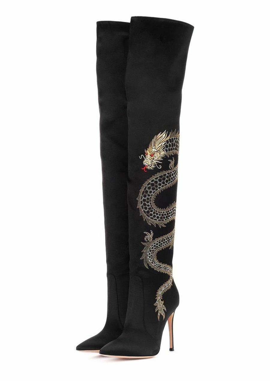 Gianvito Rossi's Dragon cuissard over-the-knee boots are crafted in Italy of lustrous black satin. Styled with a slim stiletto heel, these pointed-toe shoes feature an artfully embroidered gold and red dragon.
Designer size - 35.5 ( US - 5.5 )
4