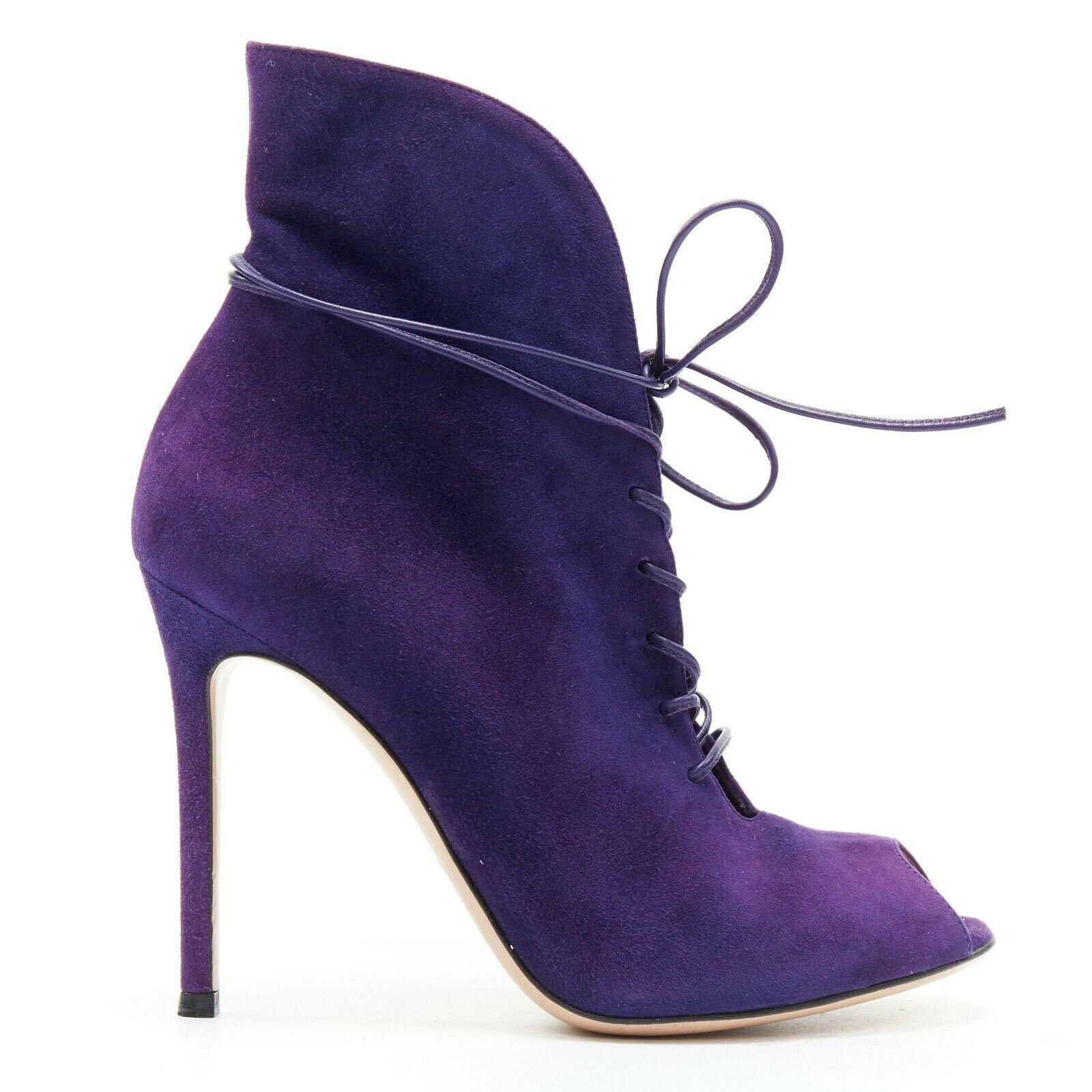 new GIANVITO ROSSI purple suede lace up peep toe deep V vamp heel bootie EU36
GIANVITO ROSSI
Purple suede leather upper. 
Peep toe. 
Leather lace up front. 
Wrap around ankle detail. 
Deep V low cut vamp. 
Curved top line. 
Slim high heel. 
Made in