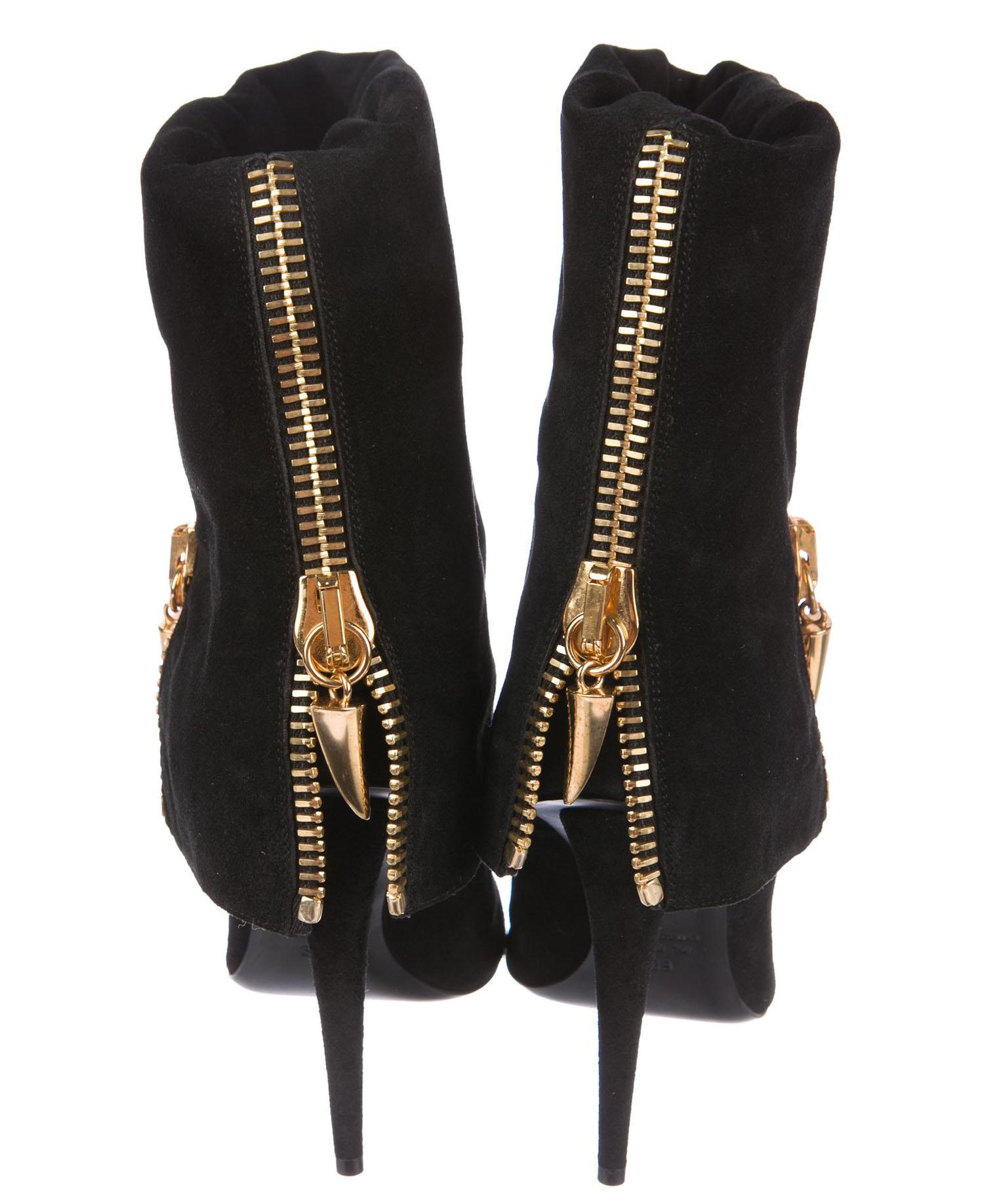 black boots with gold accents