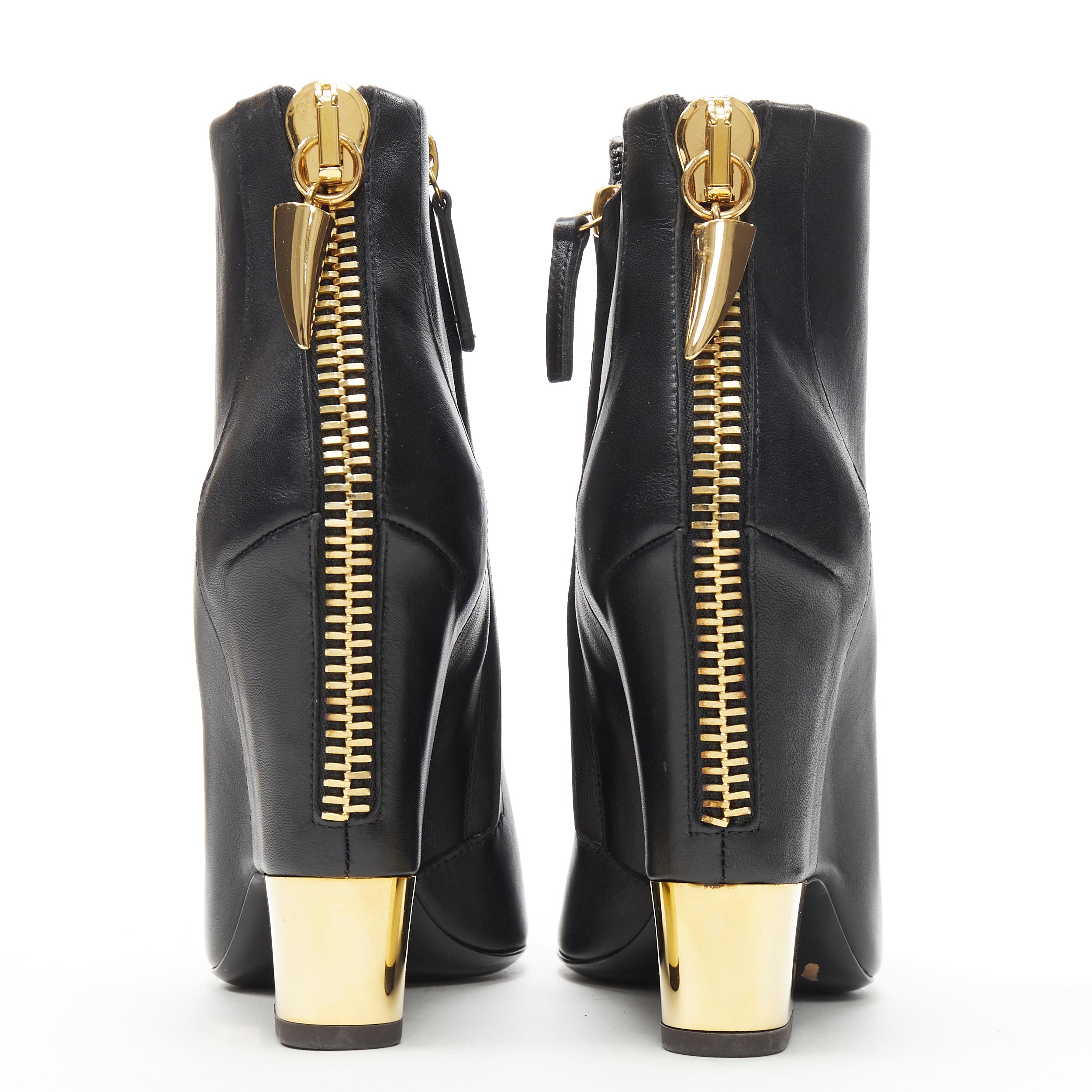 new GIUSEPPE ZANOTTI black leather gold claw zip point toe bootie EU37.5 
Reference: TGAS/A06347 
Brand: Giuseppe Zanotti 
Designer: Giuseppe Zanotti 
Material: Leather 
Color: Black 
Pattern: Solid 
Closure: Zip 
Extra Detail: Exposed zip back