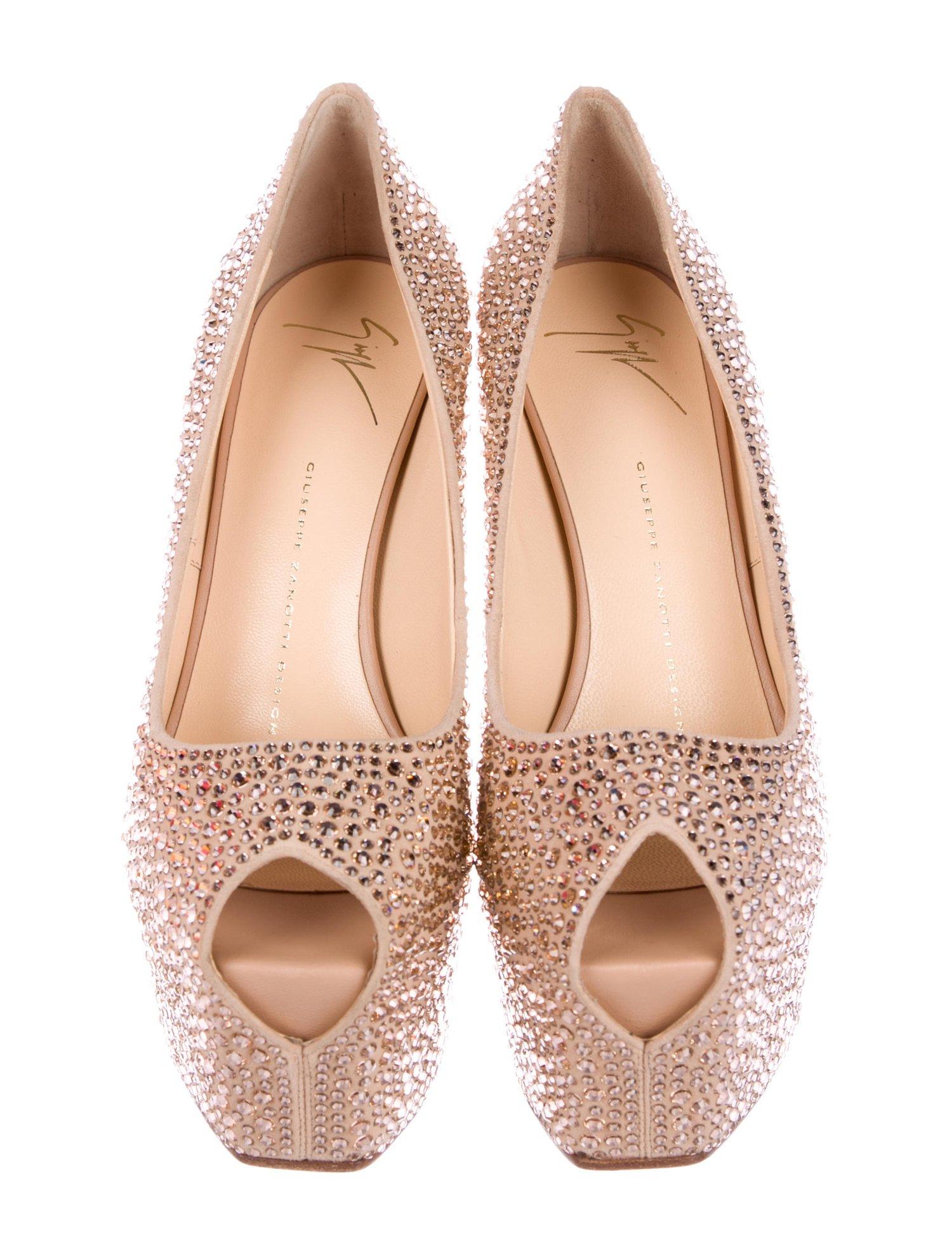 New Giuseppe Zanotti  Rhinestone-Embellished Nude Hidden Platform Peep-Toe Pumps
Designer size 38.5
Nude color pumps in gold tone rhinestone-embellished suede.
5 3/4 inches leather covered heel,  2.5 inches platform.
Peep toe, Hidden platform,