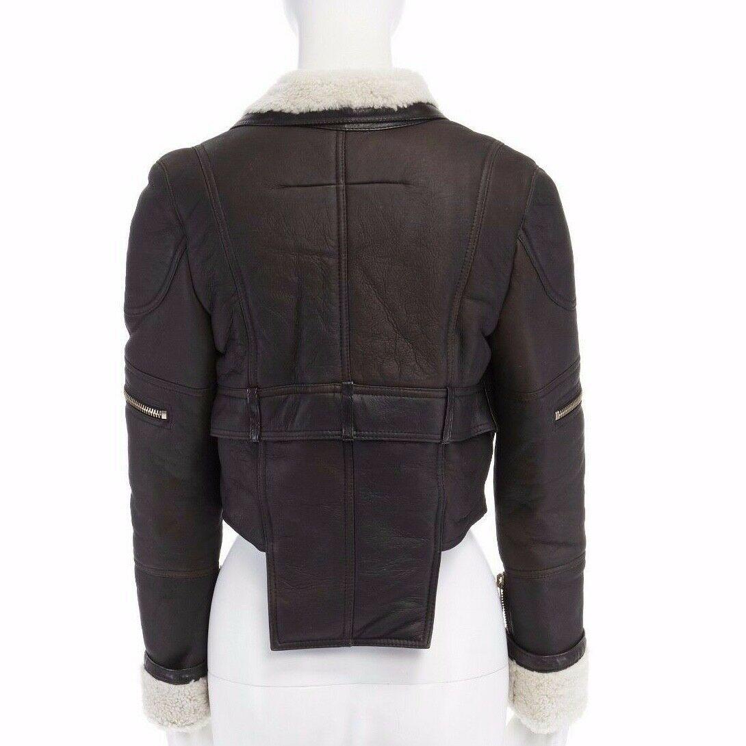 new GIVENCHY shearling lined brown leather cropped aviator biker jacket FR38 S
            
GIVENCHY by RICCARDO TISCI
Dark brown leather outer . Cream shearling lining . Notched collar . Gold hardware zipper . Zip front closure . Cropped body .
