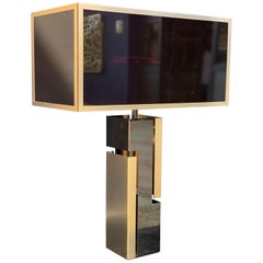 Lampada in metallo cromato oro e nero con paralume in vetro nero-rosso