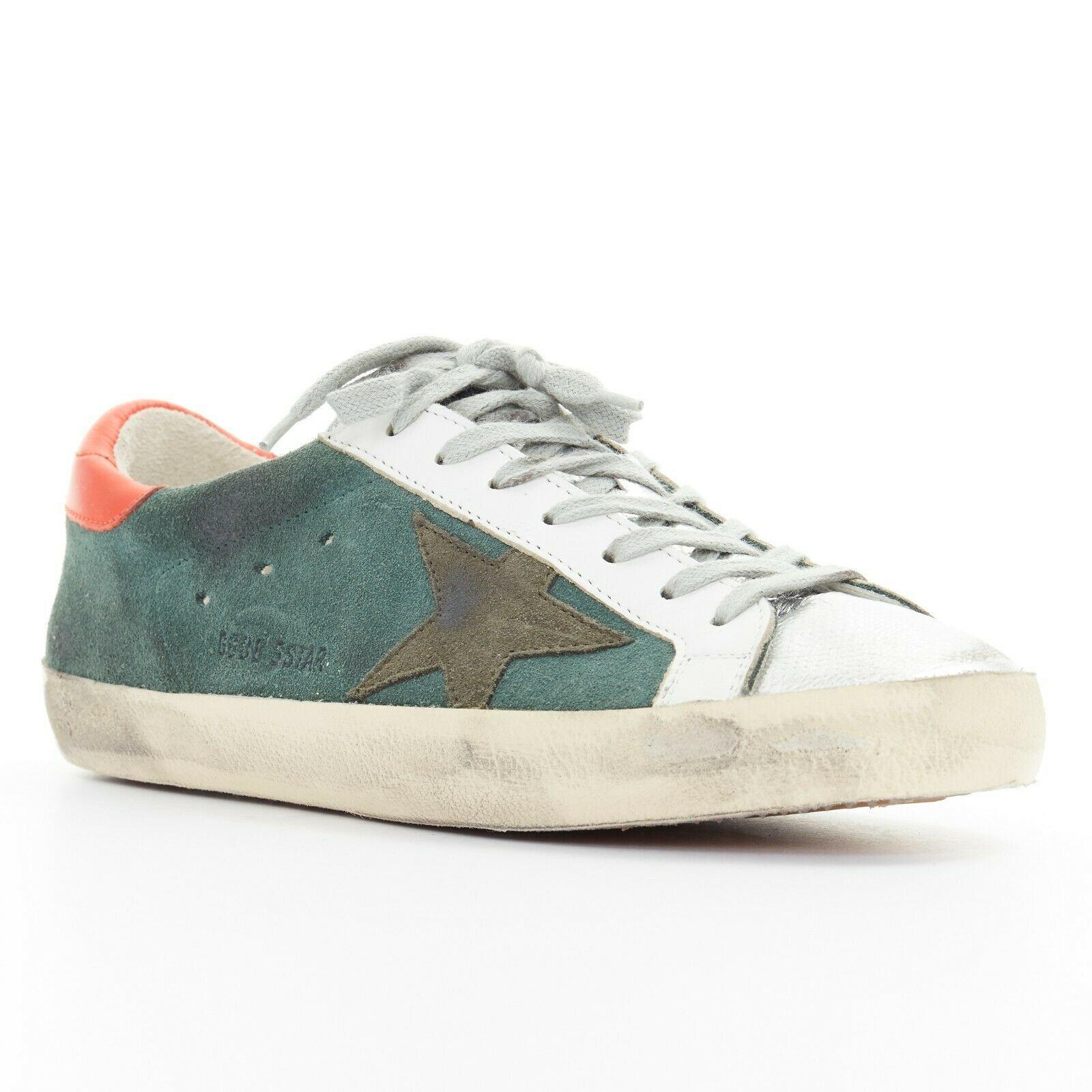 new GOLDEN GOOSE green suede silver toe distressed dirty lace up sneaker EU41
GOLDEN GOOSE
Distressed dirty style sneakers. Green/blue suede leather upper. Red leather detail at heel. 
Metallic silver leather at toe. Grey laces. Golden Goose