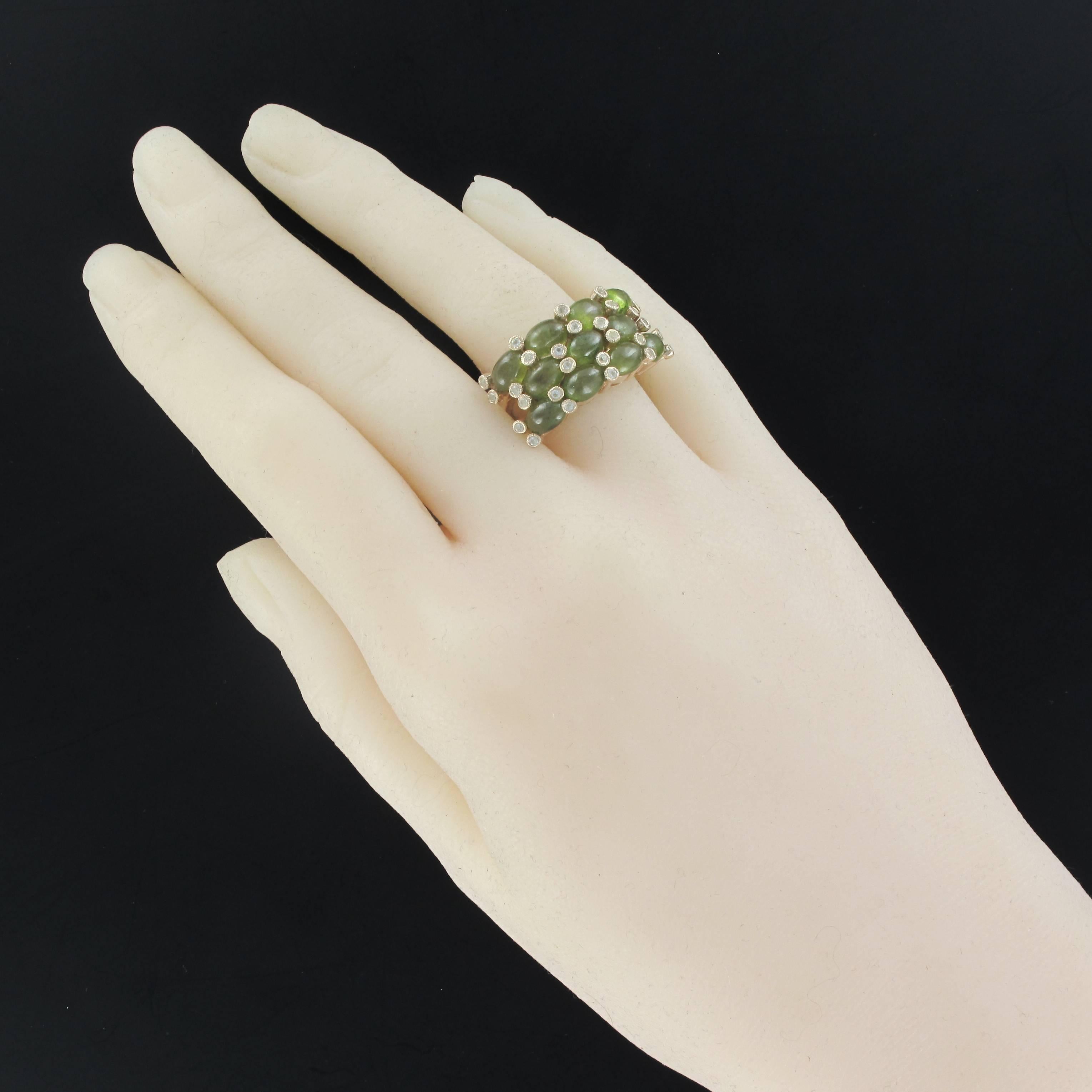 Ring in silver, 925.
This splendid ring is set on its top with 3 lines of green oval cabochon sapphires separated by white topazes set with millegrains. Set are rhodium plated rose gold.
Gemstone weight: Green sapphires: approximately 8.20 carats,