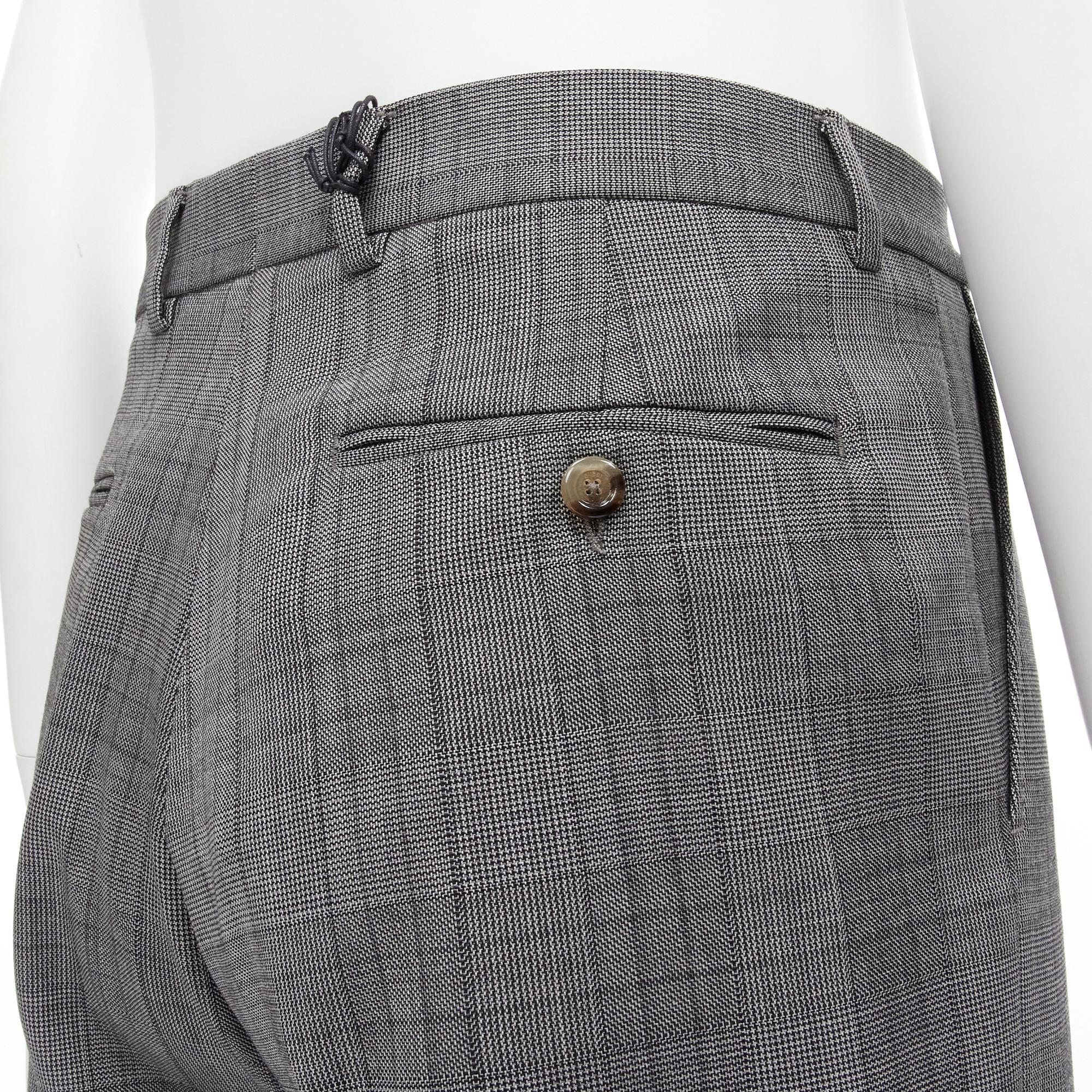 new GUCCI 100% wool checked cuffed wide leg trousers IT46R S 
Reference: EDTG/A00063 
Brand: Gucci 
Designer: Alessandro Michele 
Material: Wool 
Color: Grey 
Pattern: Check 
Closure: Zip 
Extra Detail: Concealed zip fly. 4-pockets design. Cuffed