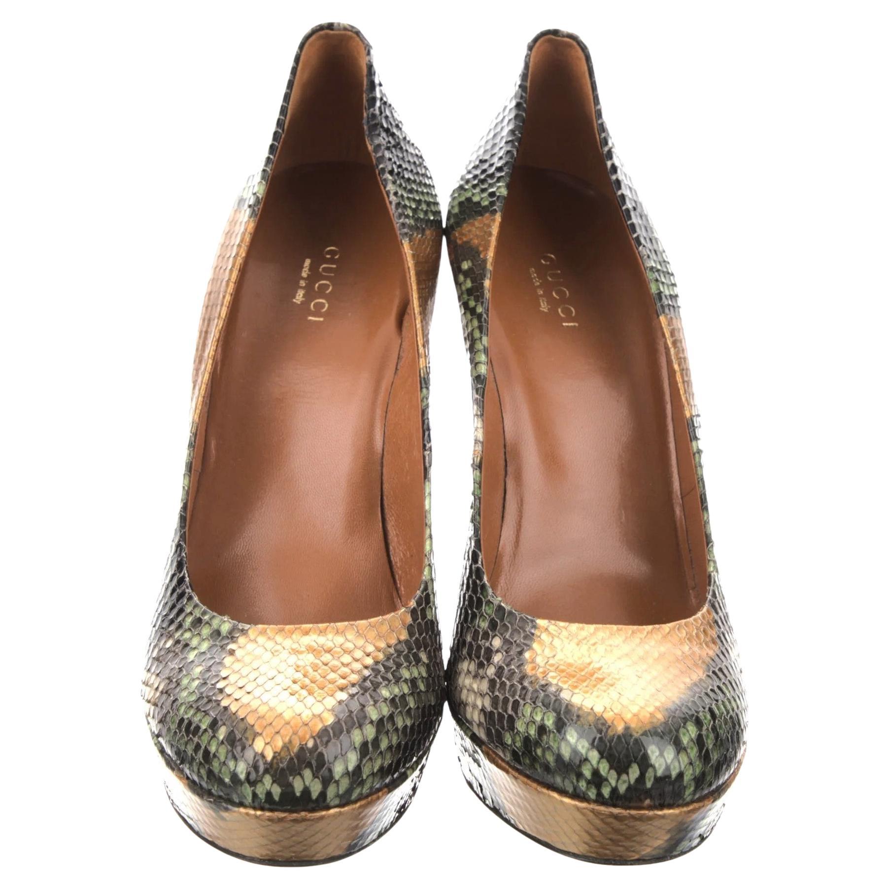 Gucci 
Brand New
$2425
* Python Heels
* Sprig 2012
* Size: 38.5
* Green & Orange, Black Snakeskin Python Throughout
Heels: 4.75