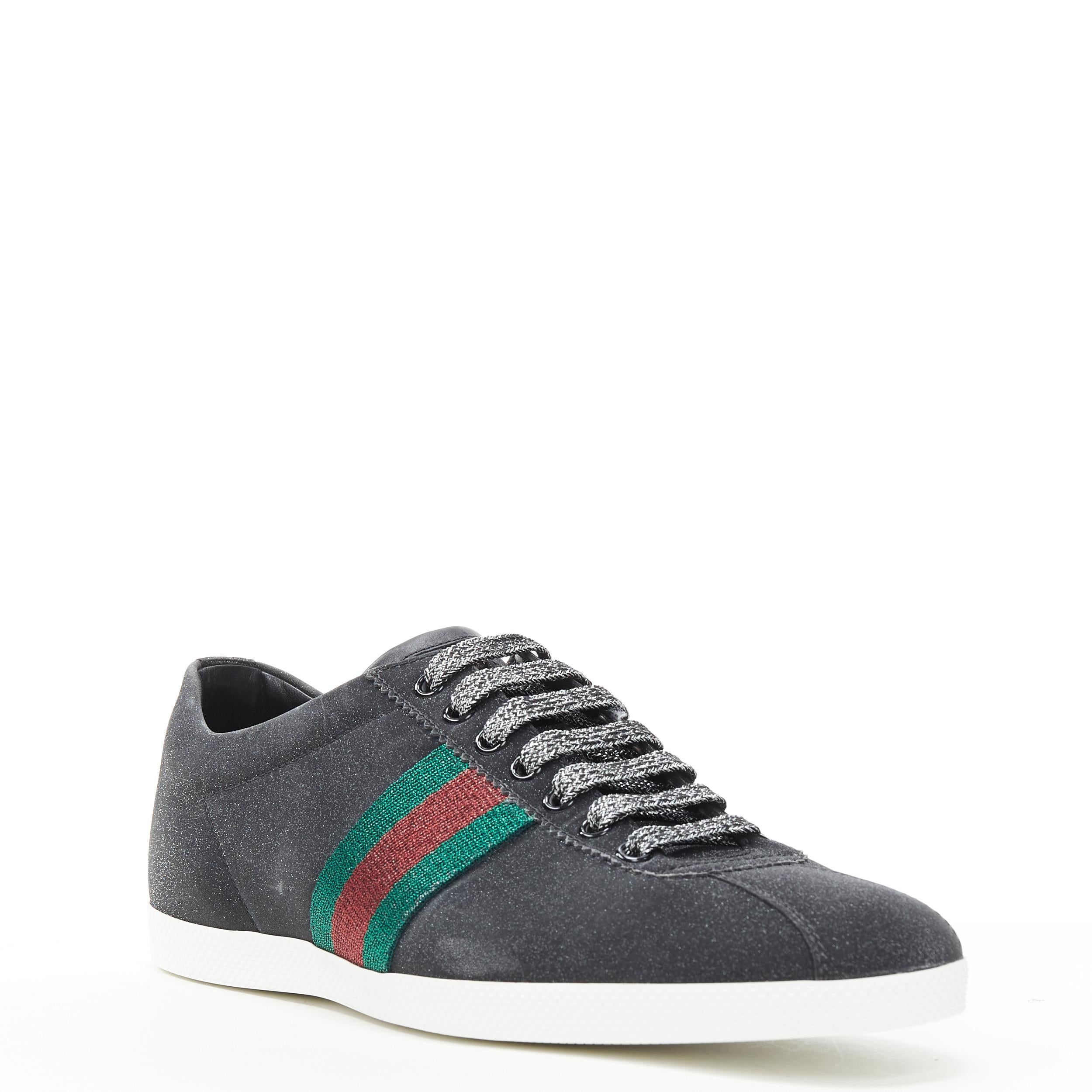 new GUCCI Glitter Web black signature web stud heel low top sneaker UK7.5 EU41.5 
Reference: TGAS/B01096 
Brand: Gucci 
Designer: Alessandro Michele 
Model: Glitter Web black 
Material: Leather 
Color: Black
Pattern: Solid Closure: Lace Up 
Extra
