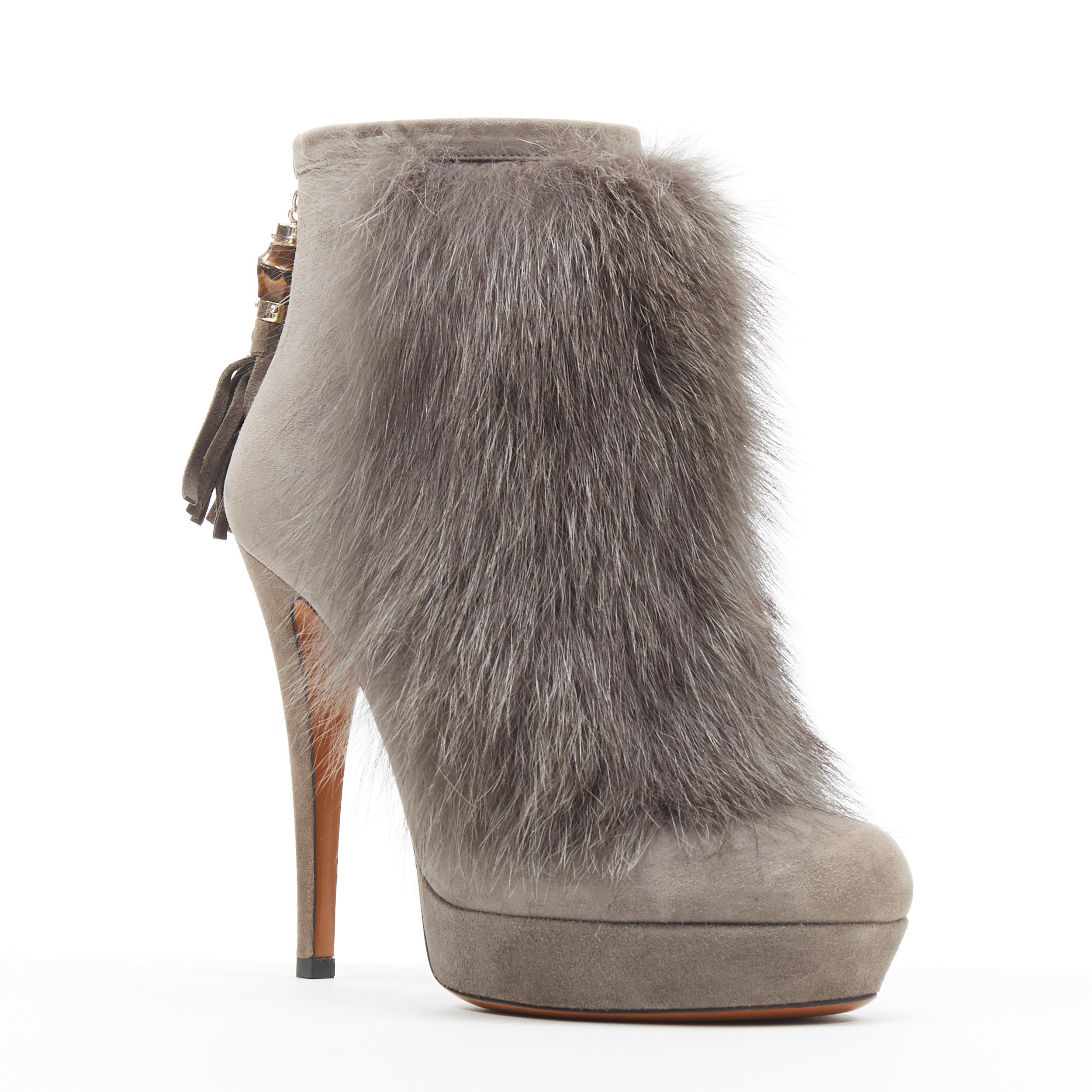 new GUCCI grey suede genuine fur bamboo tassel platform ankle bootie EU36
Brand: Gucci
Model Name / Style: Fur bootie
Material: Suede
Color: Grey
Pattern: Solid
Closure: Zip
Extra Detail: Genuine fur front. Grey suede upper. Bamboo and suede tassel