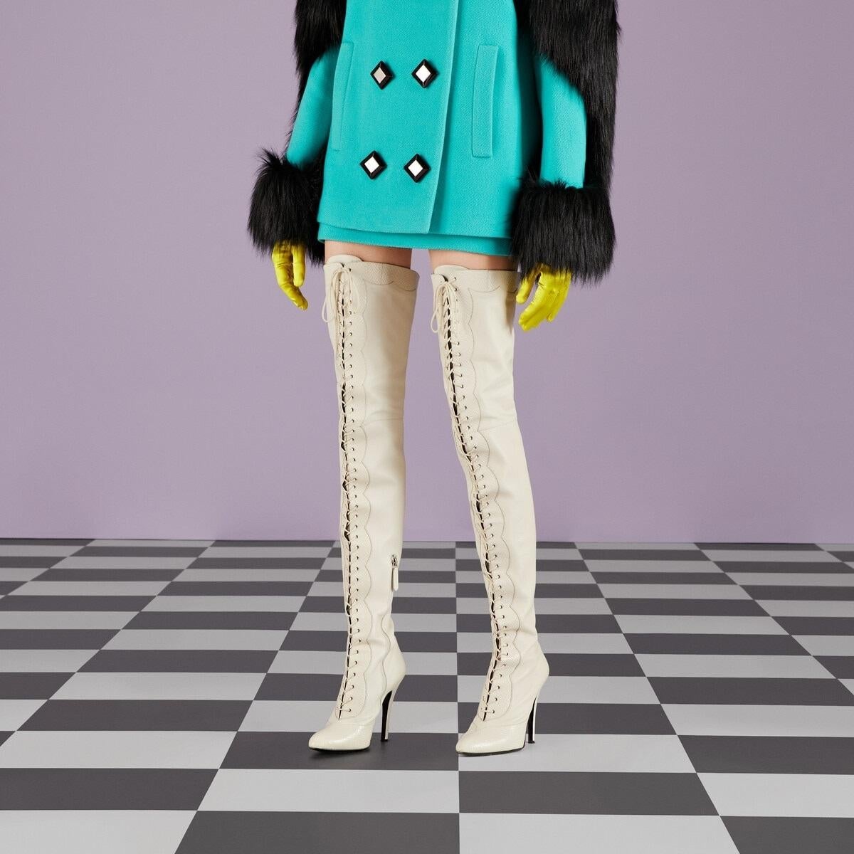 New Gucci *Harriet* Leather Over the Knee Boots
Italian size 38 - US 8
These Gucci Italian-made boots offer a luxurious look featuring supple leather, faux-snake polished accents, and an elegant lace-up front.
Vintage white color, Leather upper,