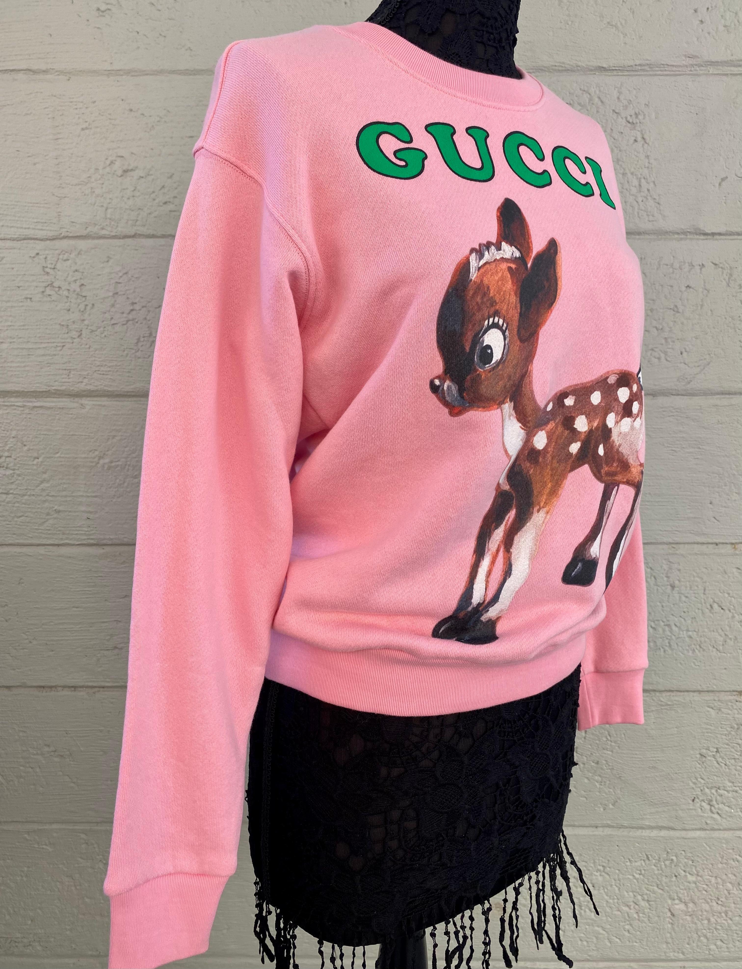 Fabulous designs evoking childhood memories are often incorporated into the Gucci collection. Limited edition collector's piece! A fawn is shown on the front of this oversize sweatshirt paired with the Gucci logo. The ladybug and flowers print on