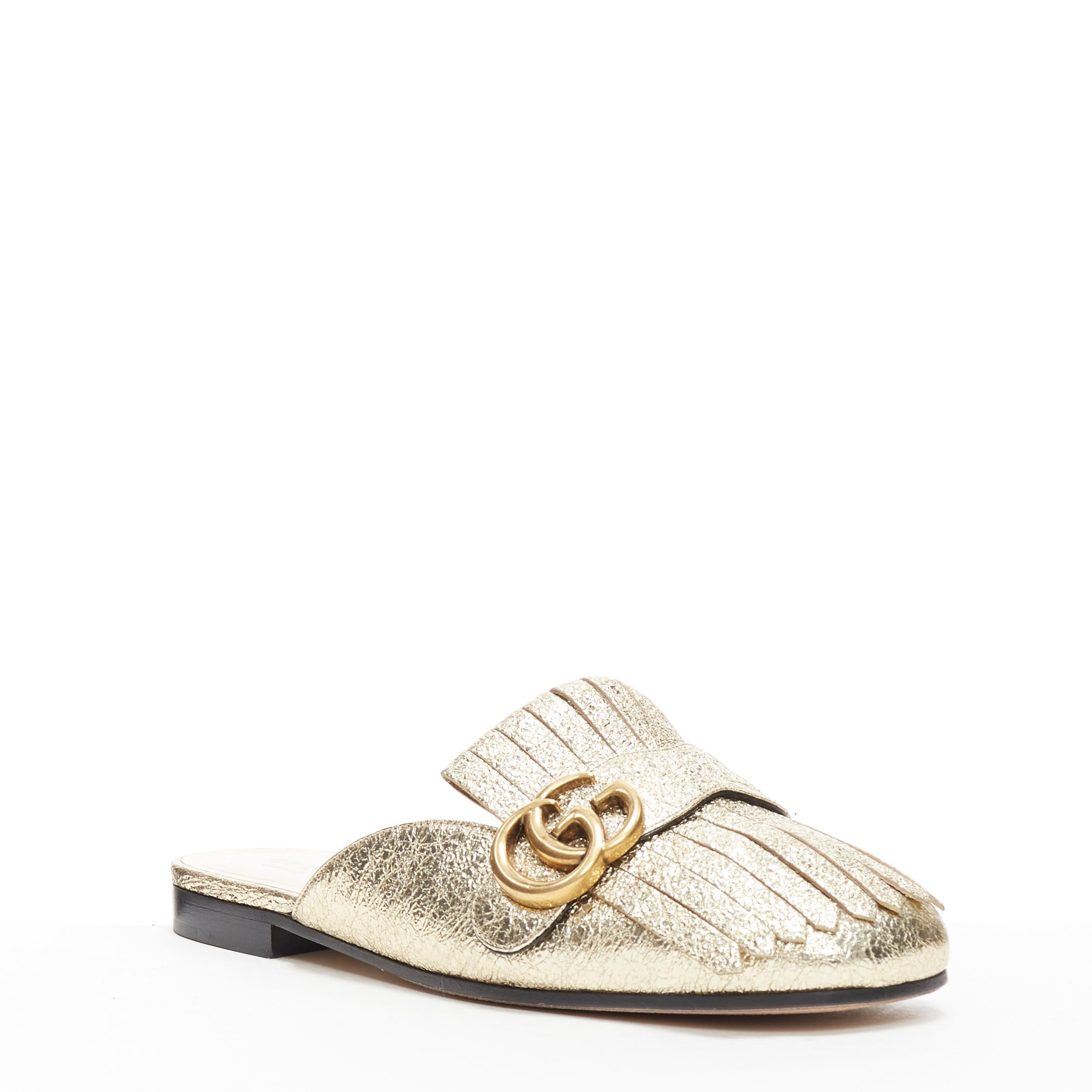 new GUCCI Marmont Platino metallic gold GG buckle fringed slip on loafers EU36.5
Brand: Gucci
Designer: Alessandro Michele
Model Name / Style: Marmont
Material: Leather
Color: Gold
Pattern: Solid
Closure: Slip on
Extra Detail: Flat (Under 1 in) heel
