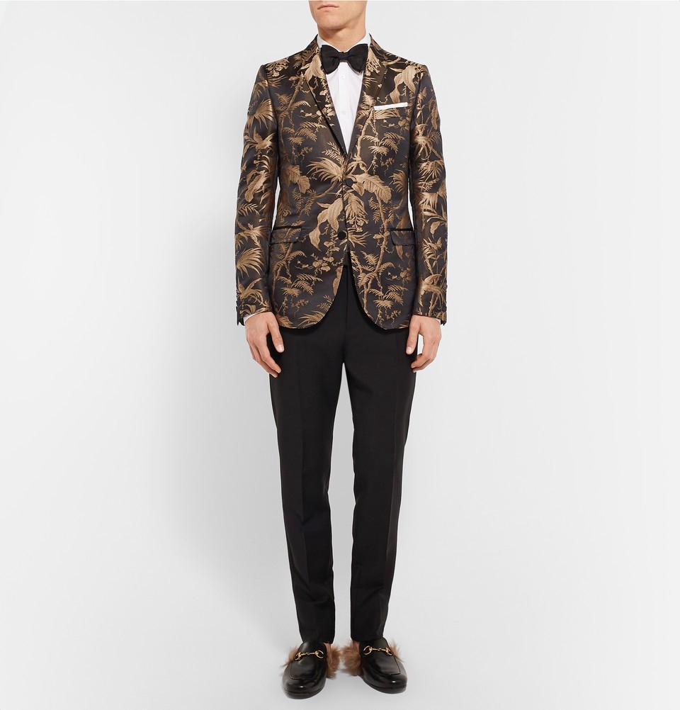New Gucci *Monaco* Jacquard Tuxedo Jacket
Designer size 48 R
This eye-catching Gucci tuxedo jacket is cut from rich black and soft gold jacquard cloth. Its tropical design is woven with a generous lashing of silk for luster and cut in a streamlined
