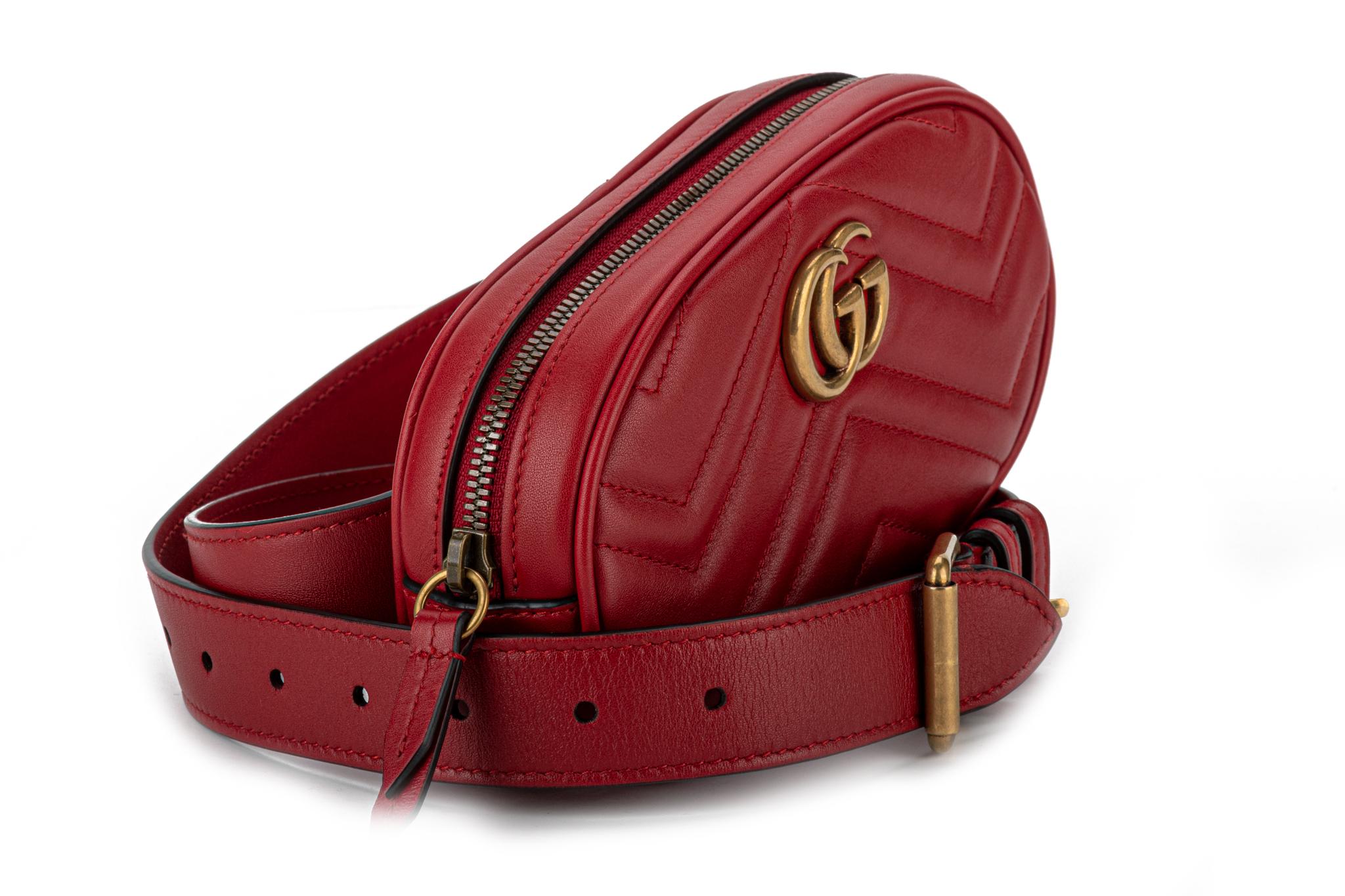 New, Red Gucci calfskin leather Matelasse GG belt bag. The adjustable belt measures 44.25