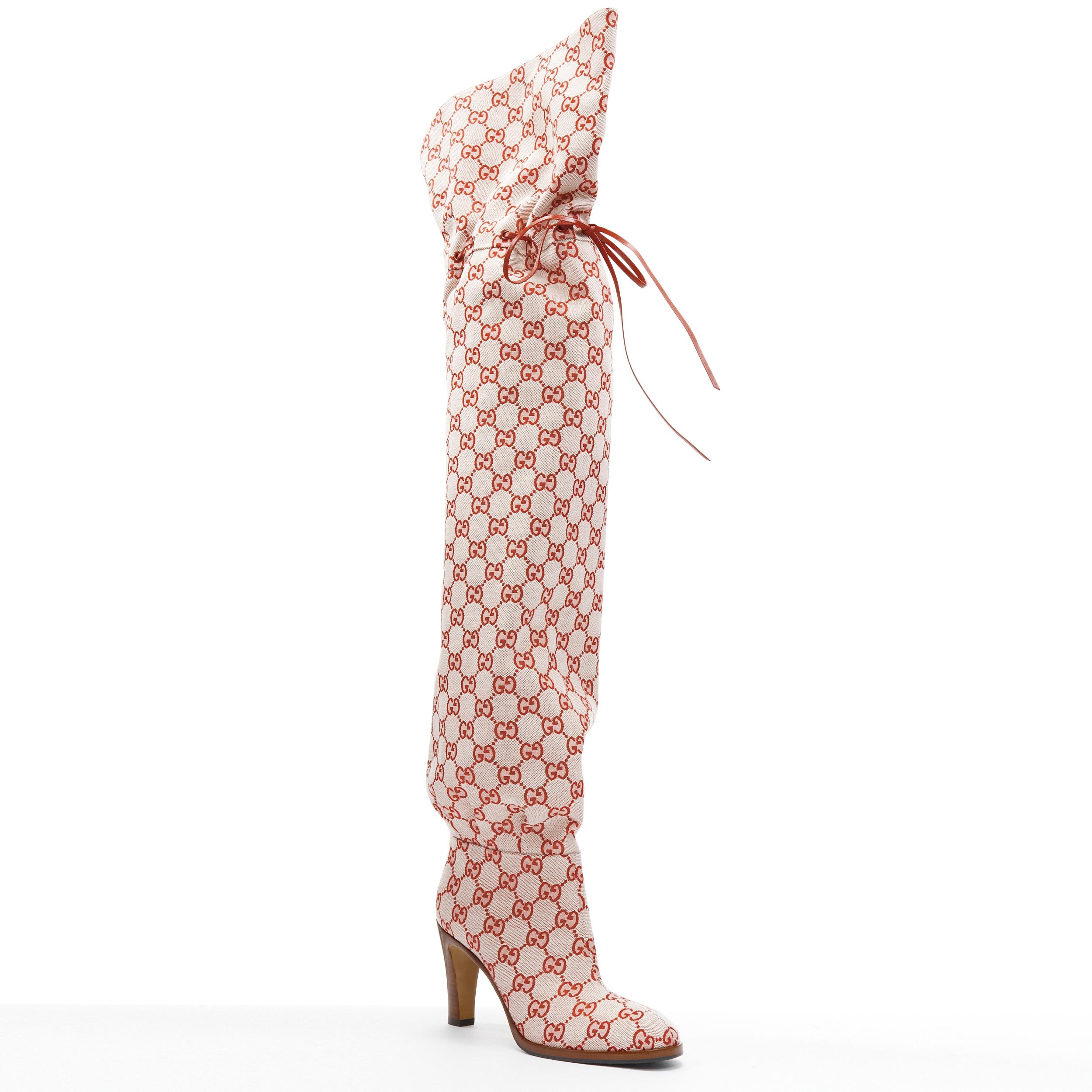 new GUCCI Runway Lisa pink monogram canvas leather tie over knee boot EU37 
Reference: TGAS/B01878 
Brand: Gucci 
Designer: Alessandro Michele 
As seen on: Beyonce, Ariana Grande 
Material: Fabric 
Color: Pink 
Pattern: Abstract 
Closure: Pull On