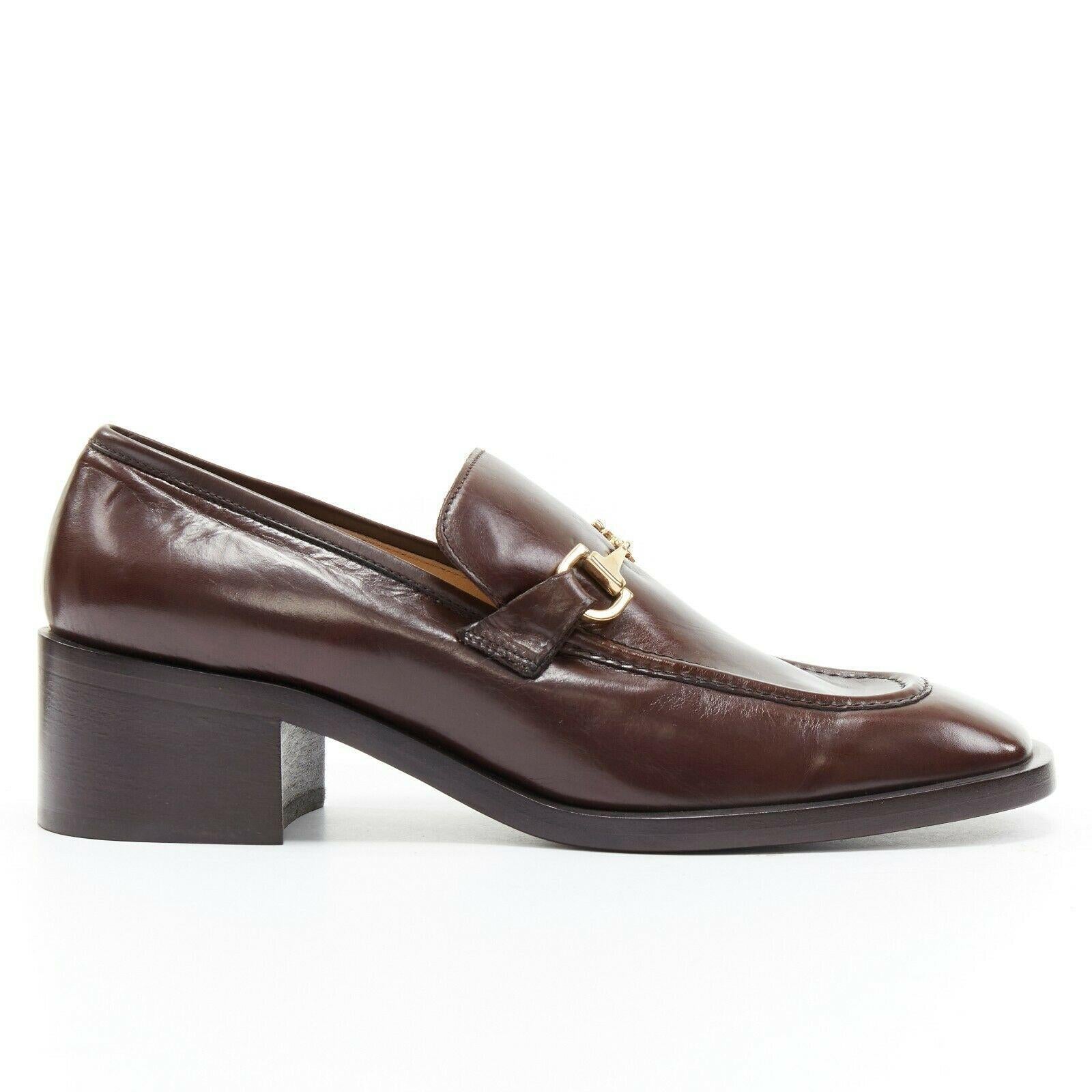 new GUCCI Vintage brown leather gold horsebit buckle square toe loafer EU36.5C

GUCCI VINTAGE
Dark brown polished leather. Gold-tone horse-bit metal buckle detail at front. Tonal stitching. Square toe. Stacked wood block heel. Slip on loafer. Made