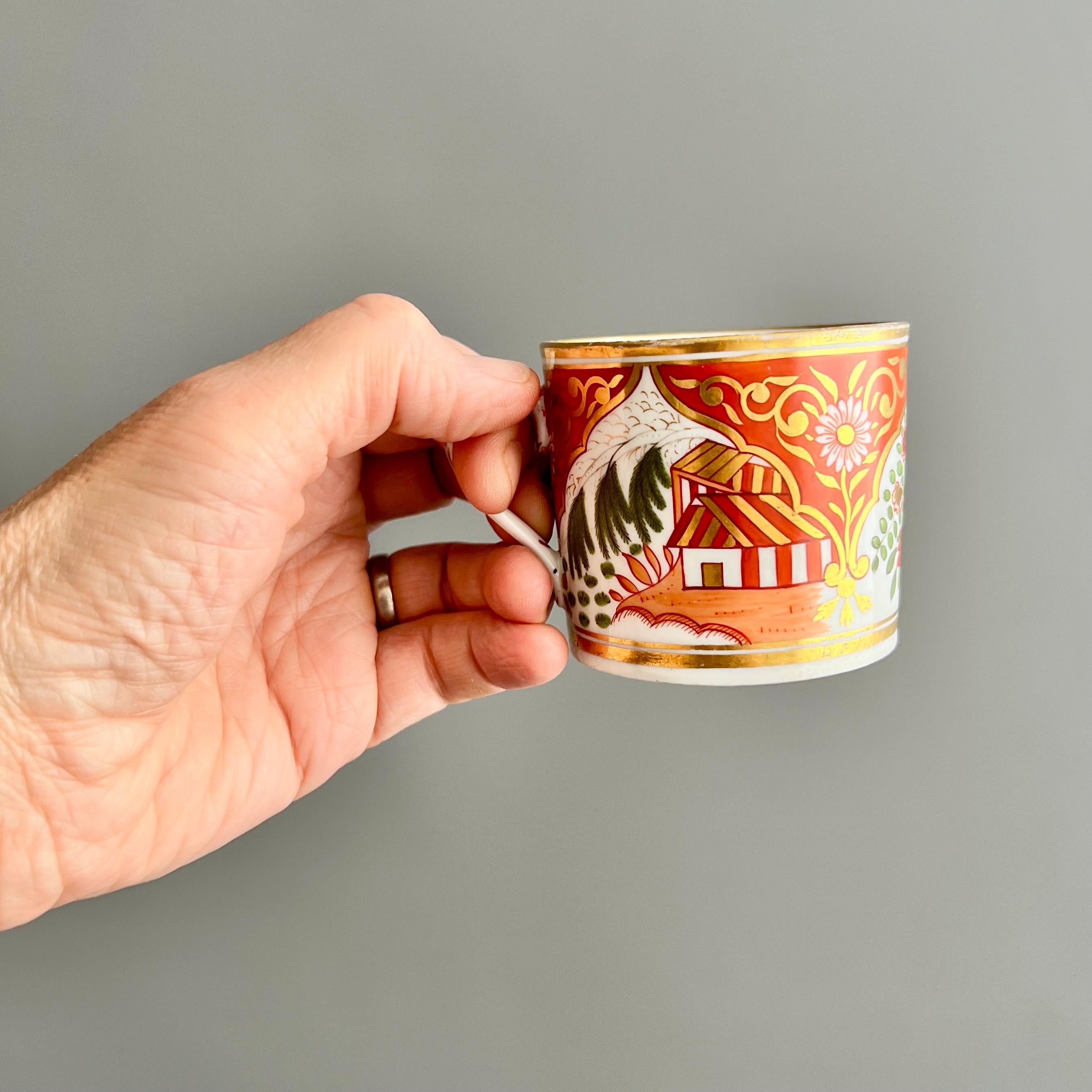 This is a super charming orphaned coffee can made by New Hall probably around the year 1810. The can is made of hybrid paste porcelain and has a wonderful Imari coloured pattern with a house and trees. This coffee can lost its saucer, but it is