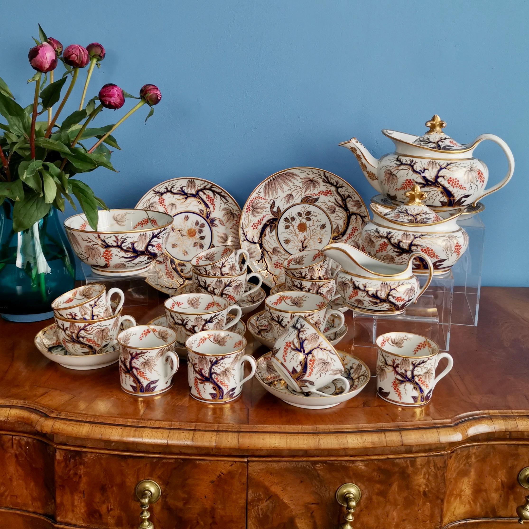 This is spectacular full tea service made by New Hall around the year 1810. The service consists of a lidded teapot on a stand, a lidded sucrier, a milk jug, six teacups and saucers, six coffee cans, two large cake plates of different sizes, and a