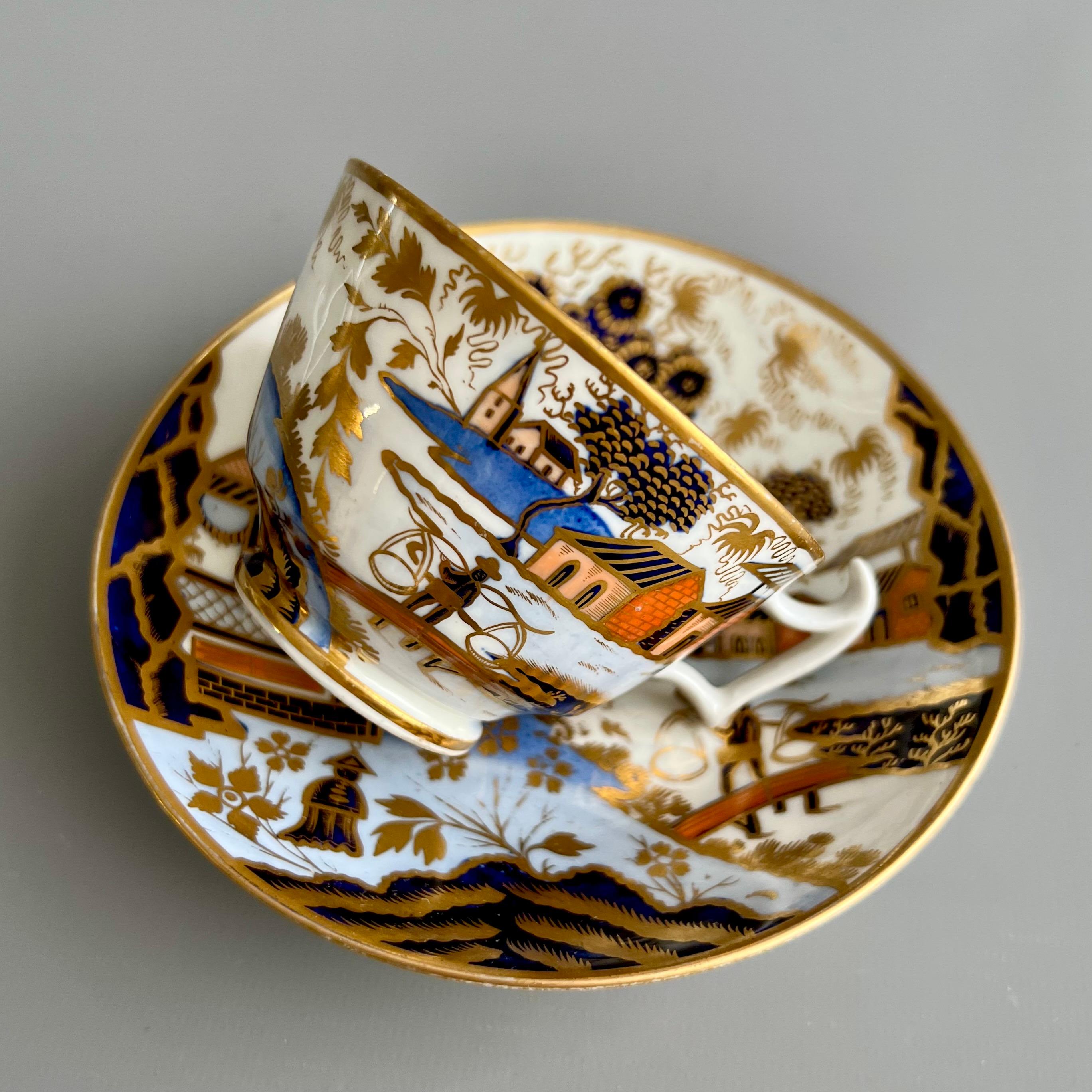 This is gorgeous teacup and saucer made by New Hall around the year 1815. The set is decorated in the popular but very rare Water Carrier pattern.

The New Hall factory started as a cooperative of several Staffordshire potters making use of the
