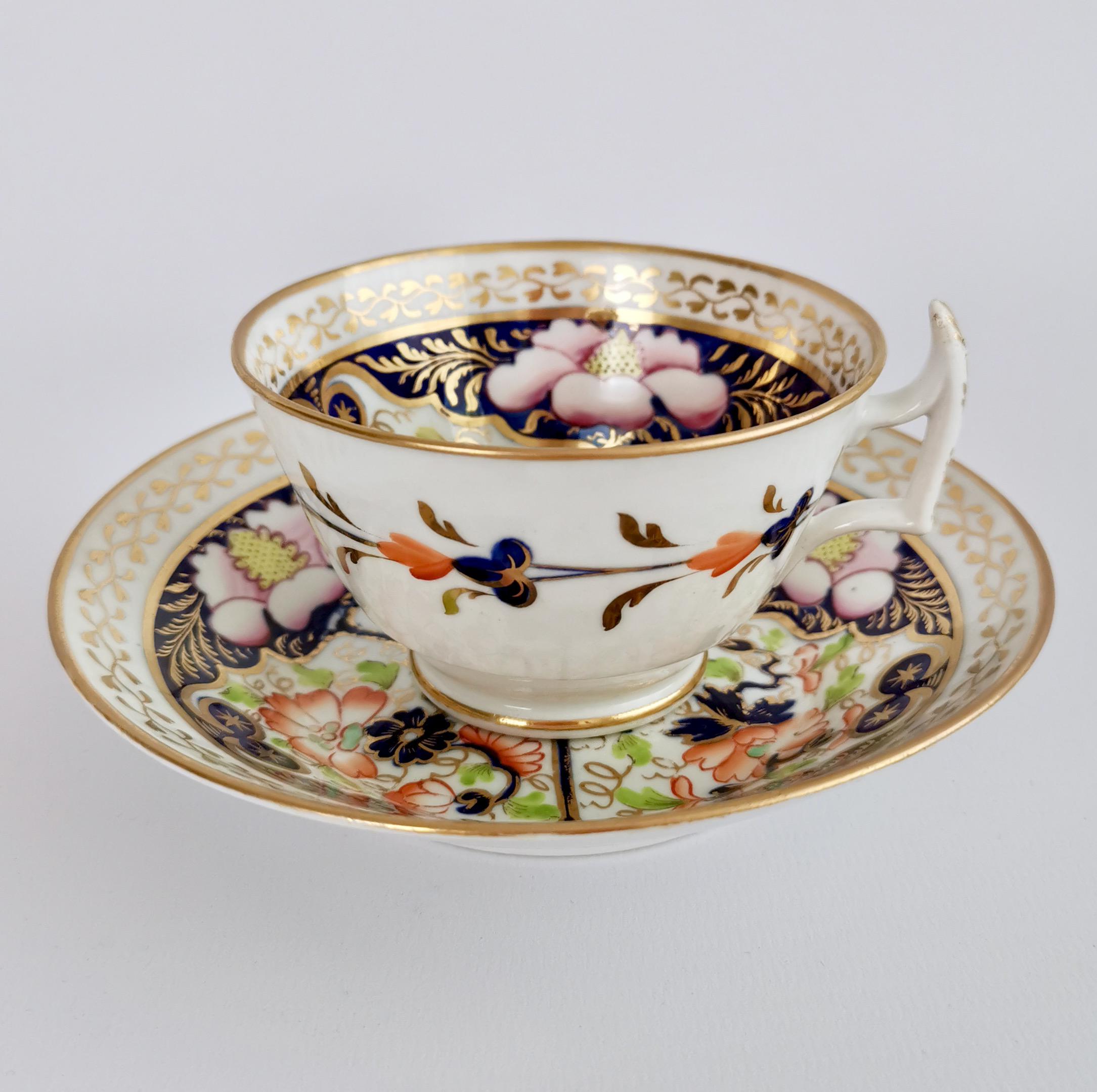 This is a beautful teacup and saucer made by New Hall around 1816, which was known as the Regency era. The set is decorated with a very striking pattern in the Imari style, but what is special about this is that it doesn't follow the usual I Imari