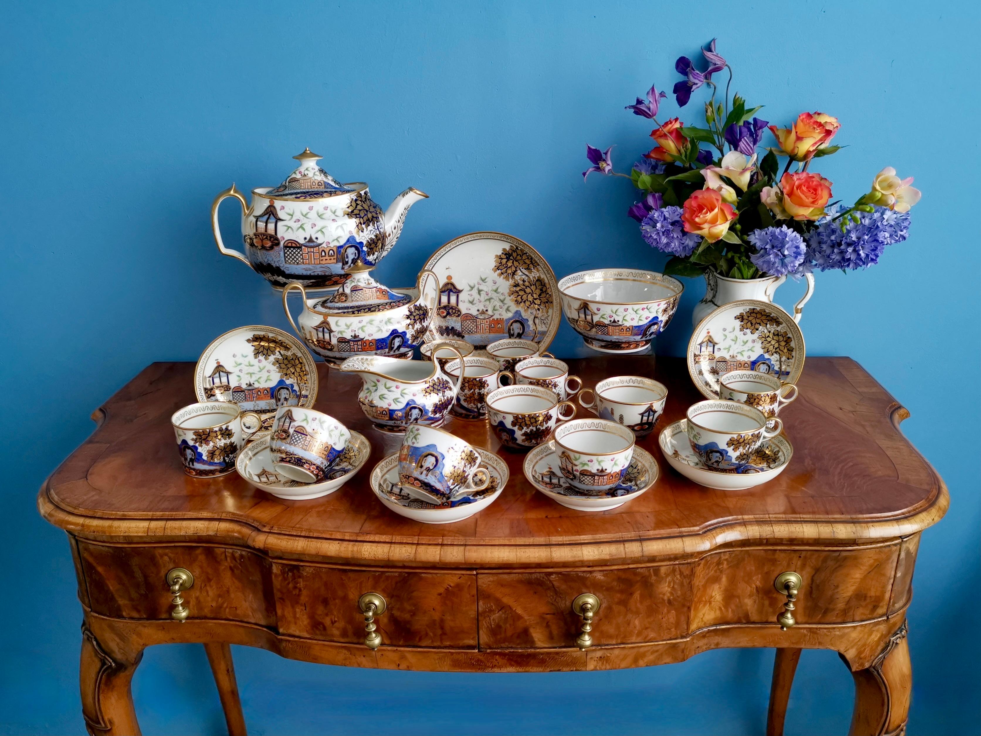 This is spectacular full tea service for six made by New Hall around the year 1810. The service consists of a teapot with cover, a sucrier with cover, a milk jug, six trios each consisting of a teacup, a coffee can and a saucer, a cake plate (saucer