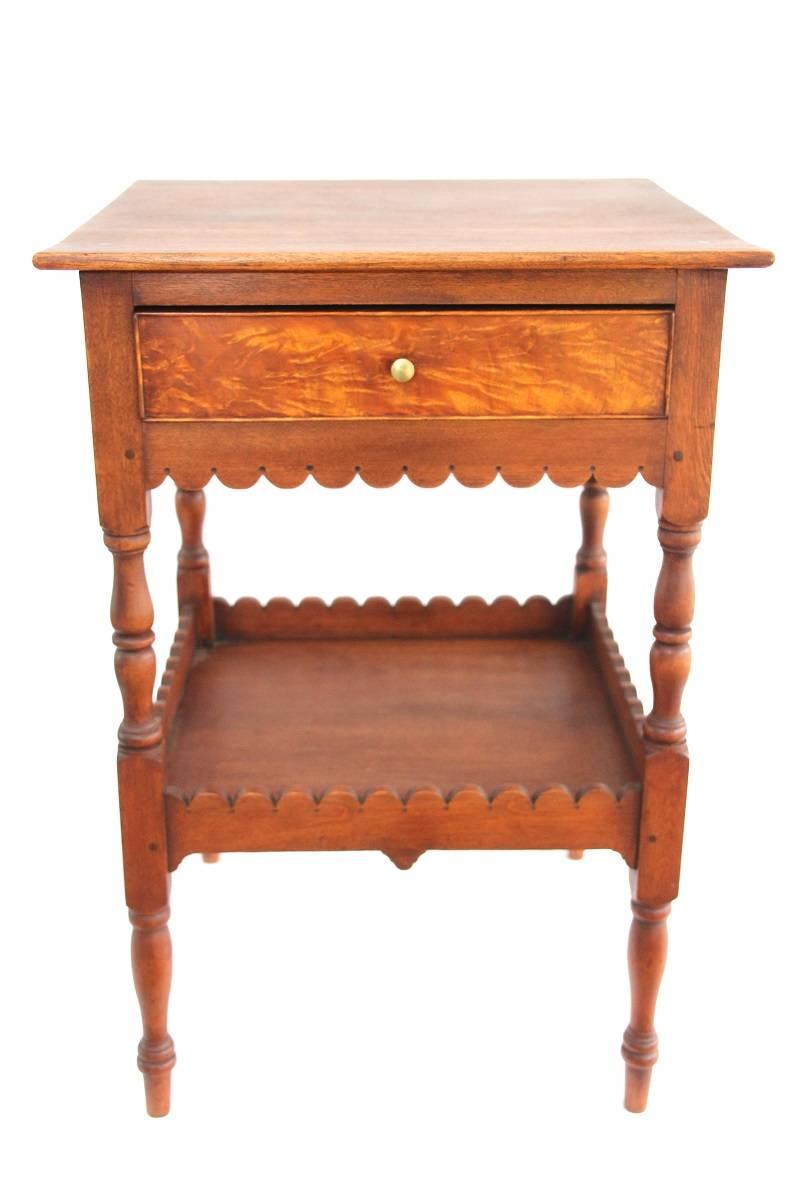 One drawer Federal stand possesses both a scalloped apron and tray. The stand is crafted entirely in birch with a flame-birch top and drawer with figured birch veneer. Stand retains original brass knob.

Coastal New Hampshire, circa