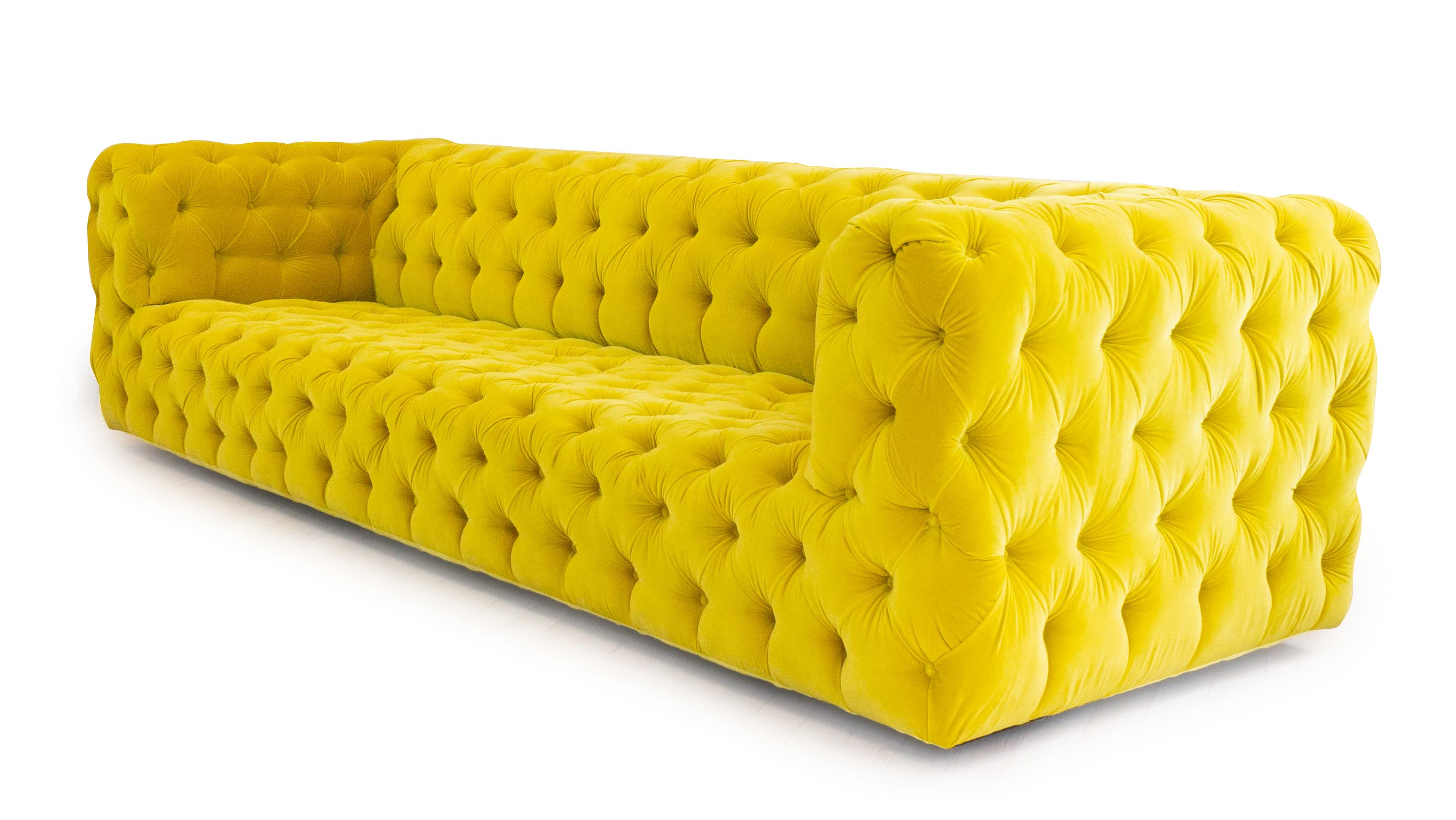 This tufted sofa in the Chesterfield style includes over 250 buttons. The sofa features a  luxurious deep, low seat and upholstered in rich yellow velvet. The frame is made from real wood using glue and dowel joinery. 

Measurements:
Outside 120