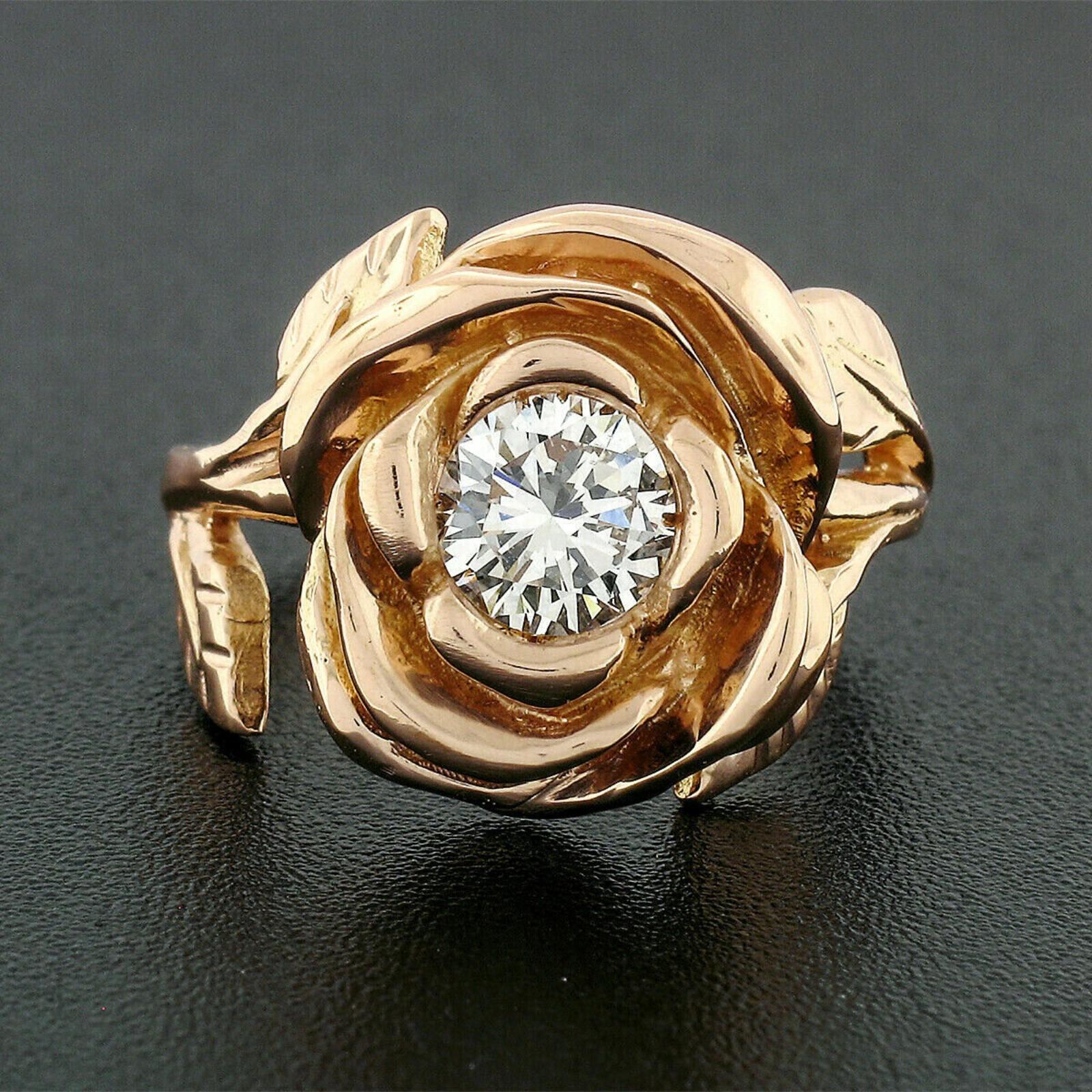 Here we have a gorgeous diamond rose flower ring hand crafted in solid 18k rose gold. The ring features a very unique and truly heart warming rose flower design, prong set with a round brilliant cut at its center. This solitaire diamond weighs 0.72