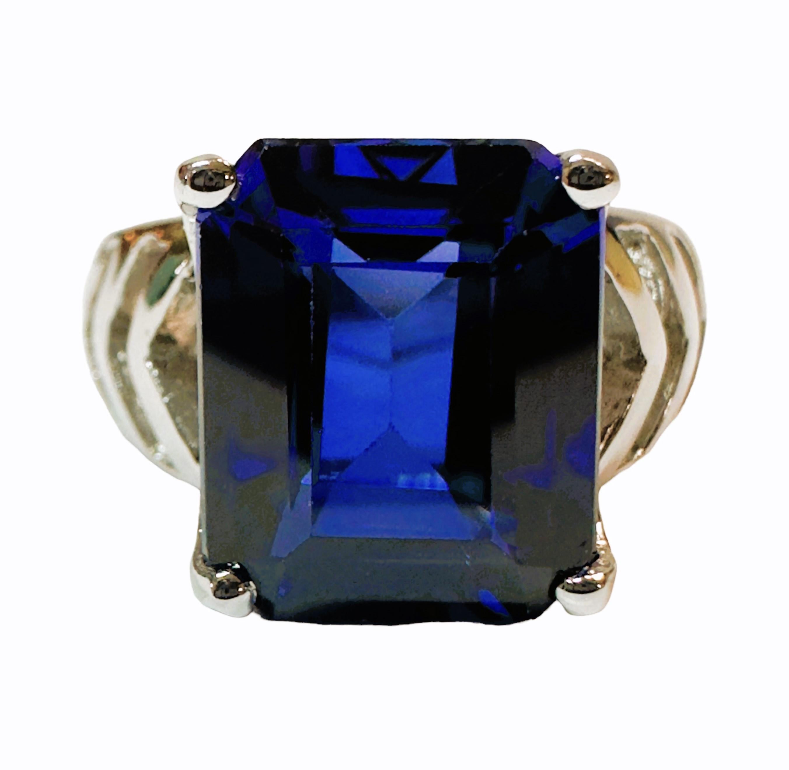 The ring is a size 7.25 and has just a beautiful and brilliant sapphire stone.  It is a high quality stone.  The stone is an emerald cut stone and is 8.30 cts.   It measures 12 x 9.7 mm.  It is in a beautiful handmade laser cut setting that has a