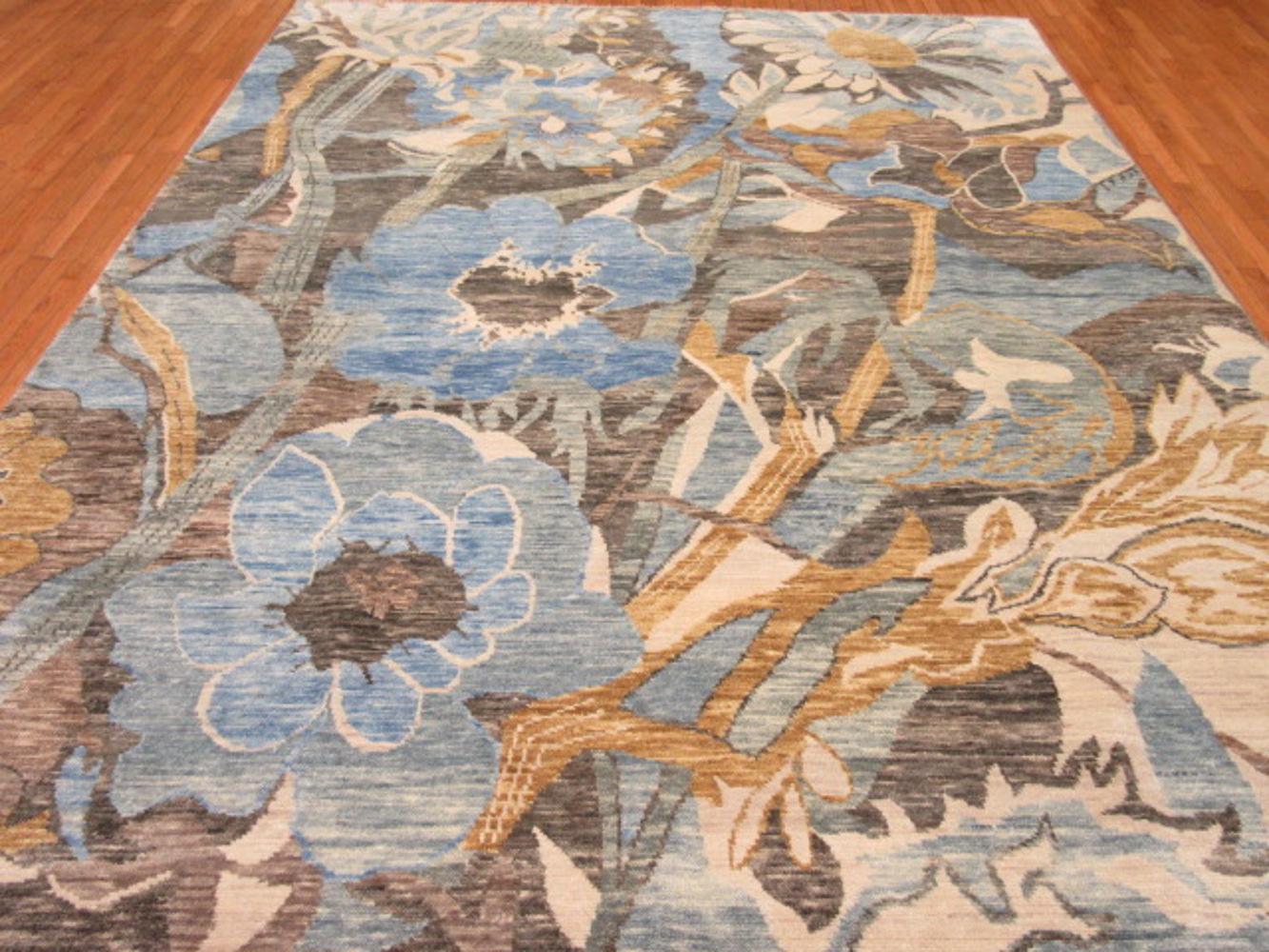 This is a new handmade rug in India with a large-scale modern contemporary design. It is made with wool on cotton foundation. The rug measures: 9' x 12' and in new condition.