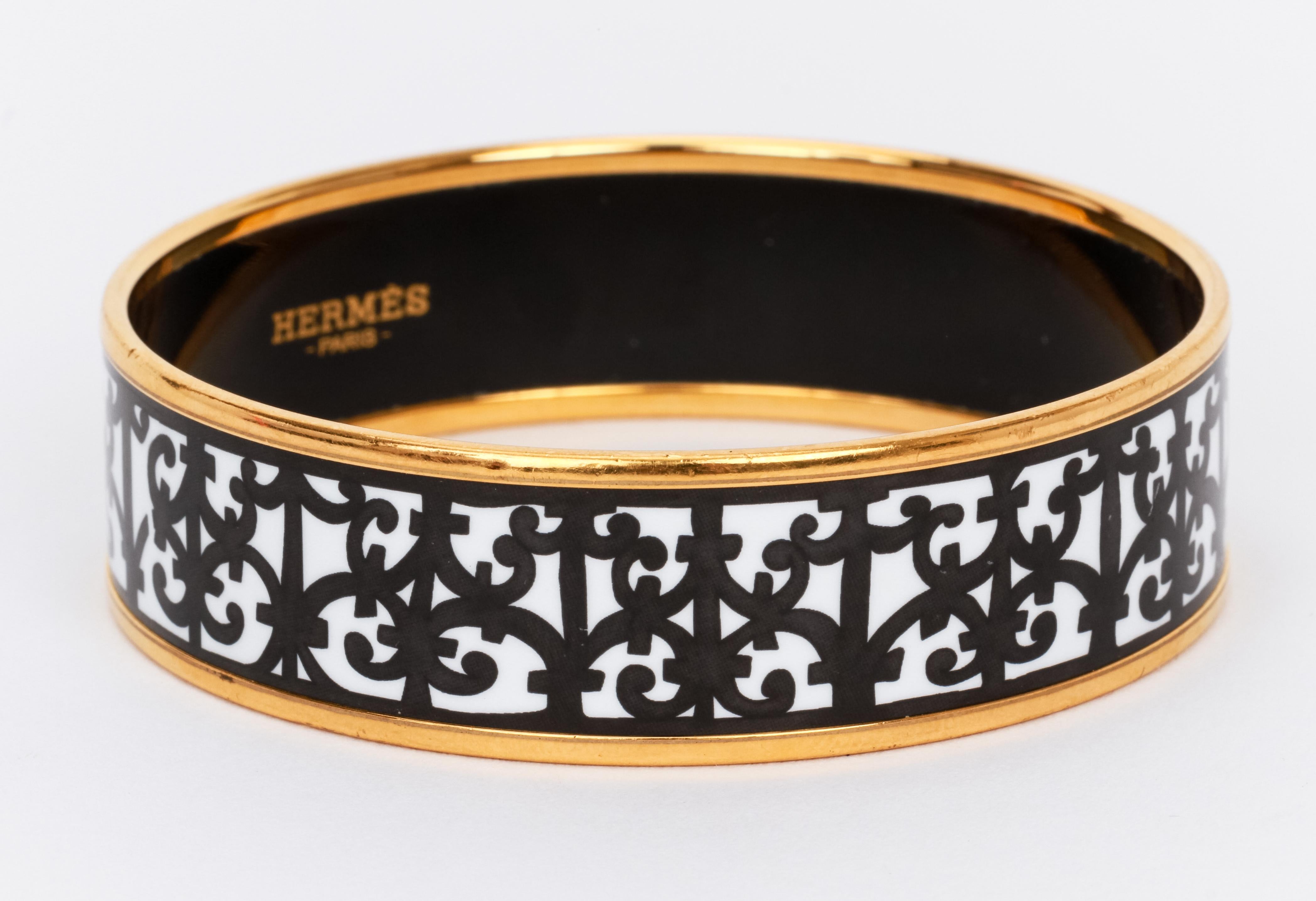 Hermes Balcons du Guadalquivir bangle bracelet in black and white enamel with gold borders