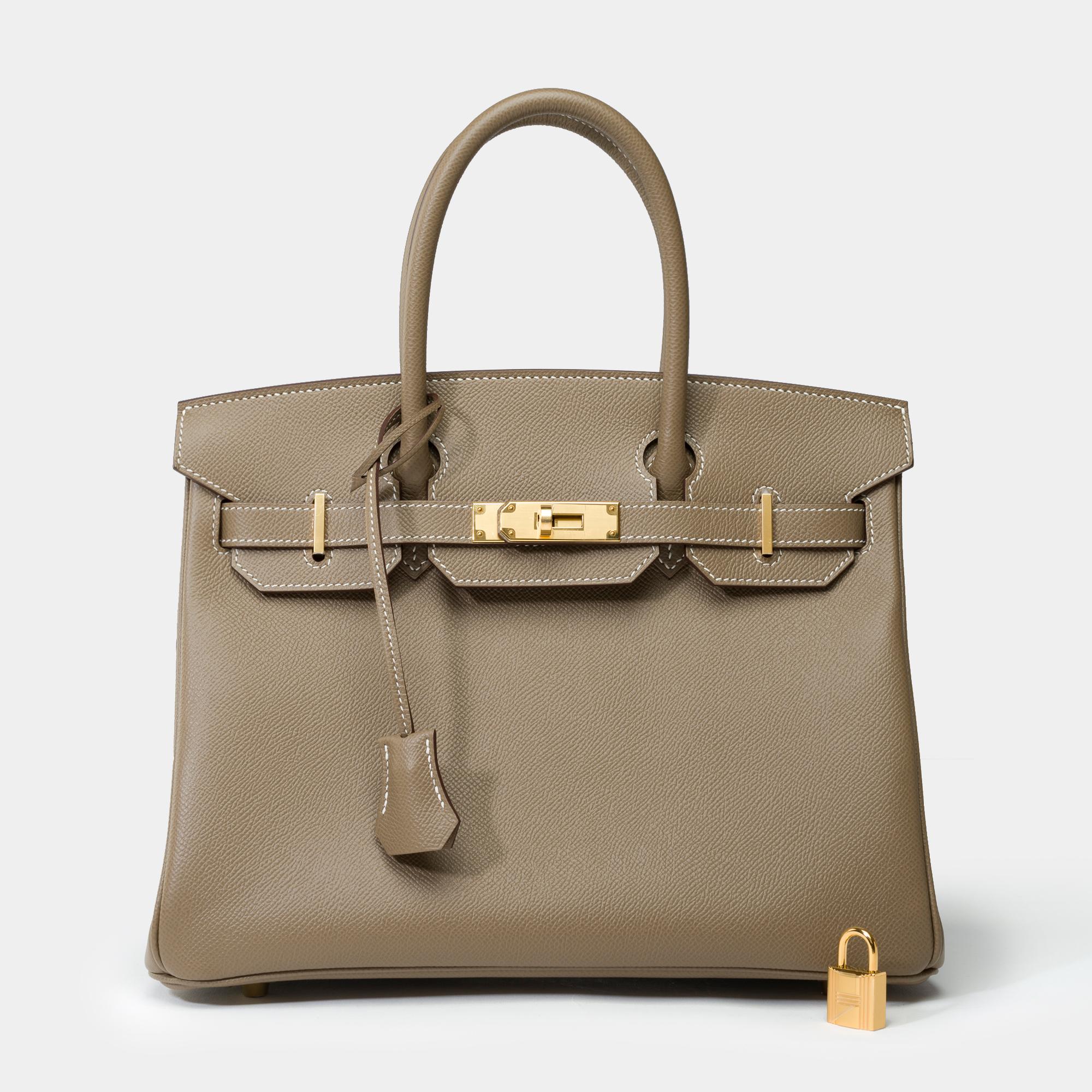 Exceptional​ ​and​ ​highly​ ​sought-after​ ​Hermes​ ​Birkin​ ​30​ ​handbag​ ​in​ ​Étoupe​ ​Epsom​ ​leather,​ ​with​ ​gold-plated​ ​hardware,​ ​and​ ​double​ ​gray​ ​leather​ ​handles​ ​for​ ​hand​ ​carry

Flap​ ​closure
Gray​ ​leather​ ​lining,​