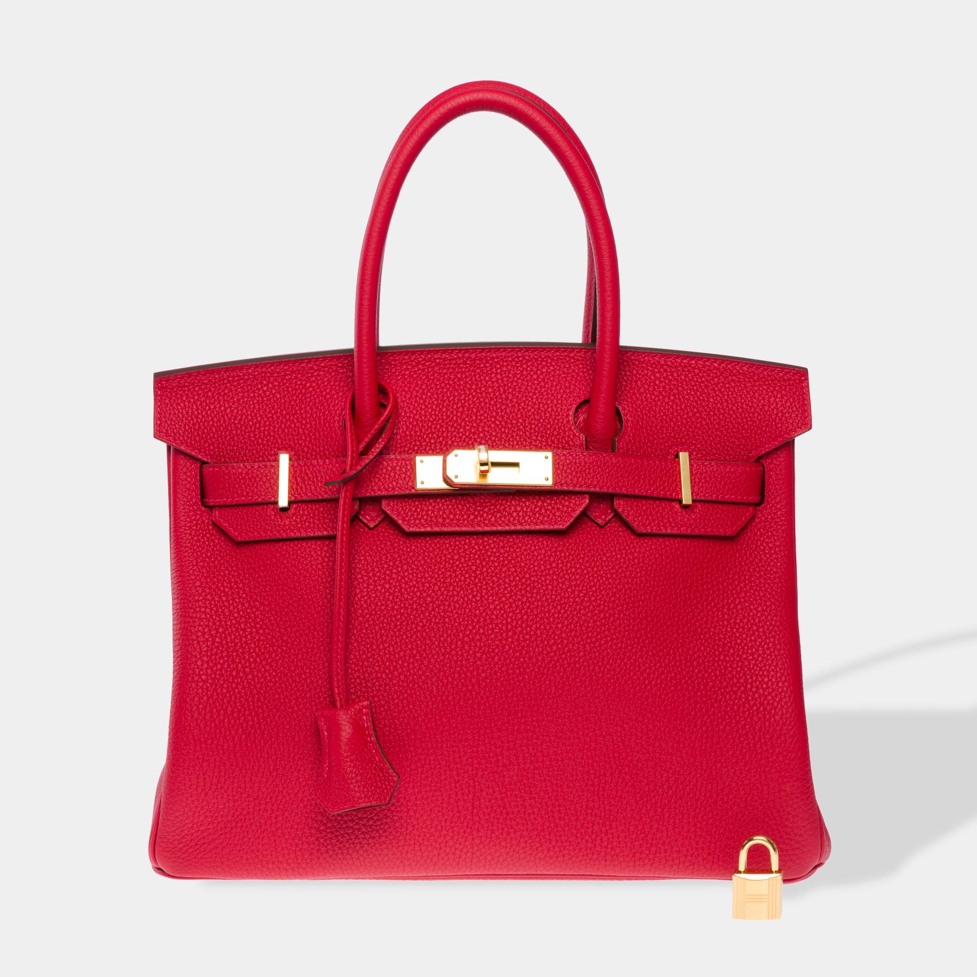 Exceptional​ ​Hermes​ ​Birkin​ ​30​ ​handbag​ ​in​ ​Rouge​ ​Casaque​ ​Togo​ ​calf​ ​leather,​ ​gold​ ​metal​ ​trim,​ ​double​ ​red​ ​leather​ ​handle​ ​for​ ​hand​ ​carry

Flap​ ​closure
Red​ ​leather​ ​interior​ ​lining,​ ​one​ ​zipped​ ​pocket,​