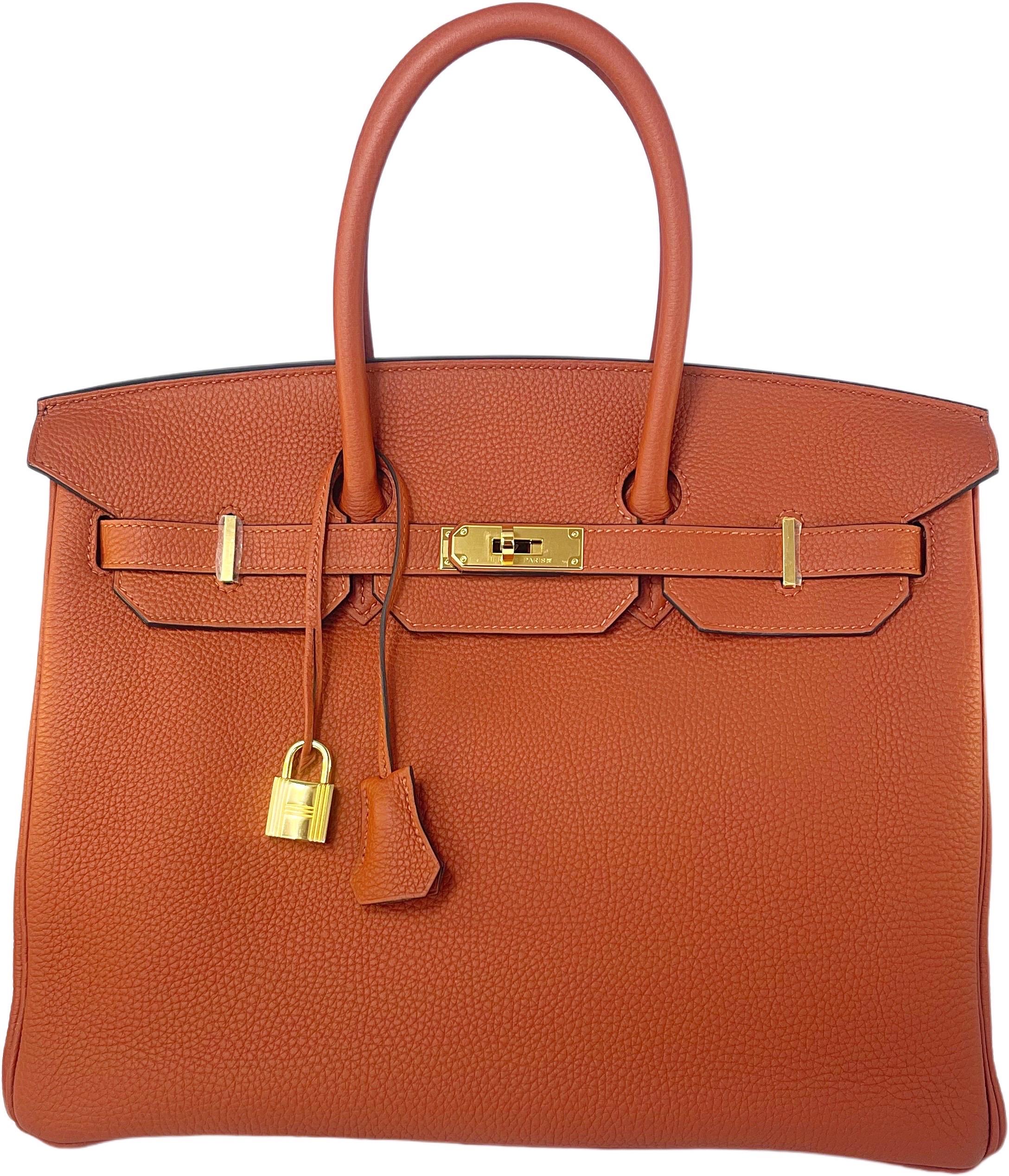 Brand new Hermes Birkin 35 in cuivre color, Togo leather, and gold hardware. This color and size are extremely rare, and nearly impossible to find. Purchased in 2016, and never used. The clear plastic protective coverings are still on all of the