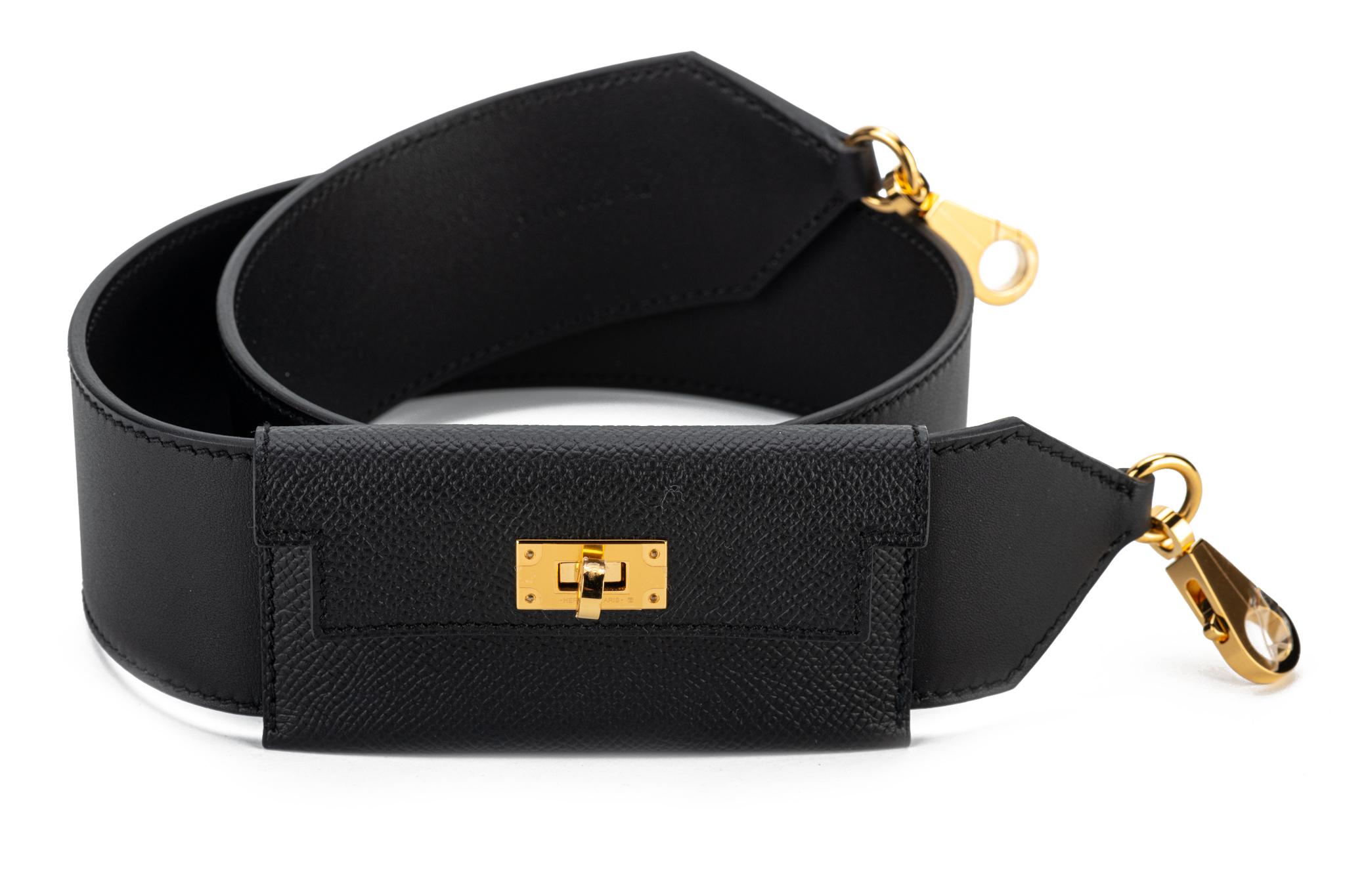Hermès Kelly pochette bandouliere in black Epsom leather and goldtone hardware. New with original dust cover and box.
