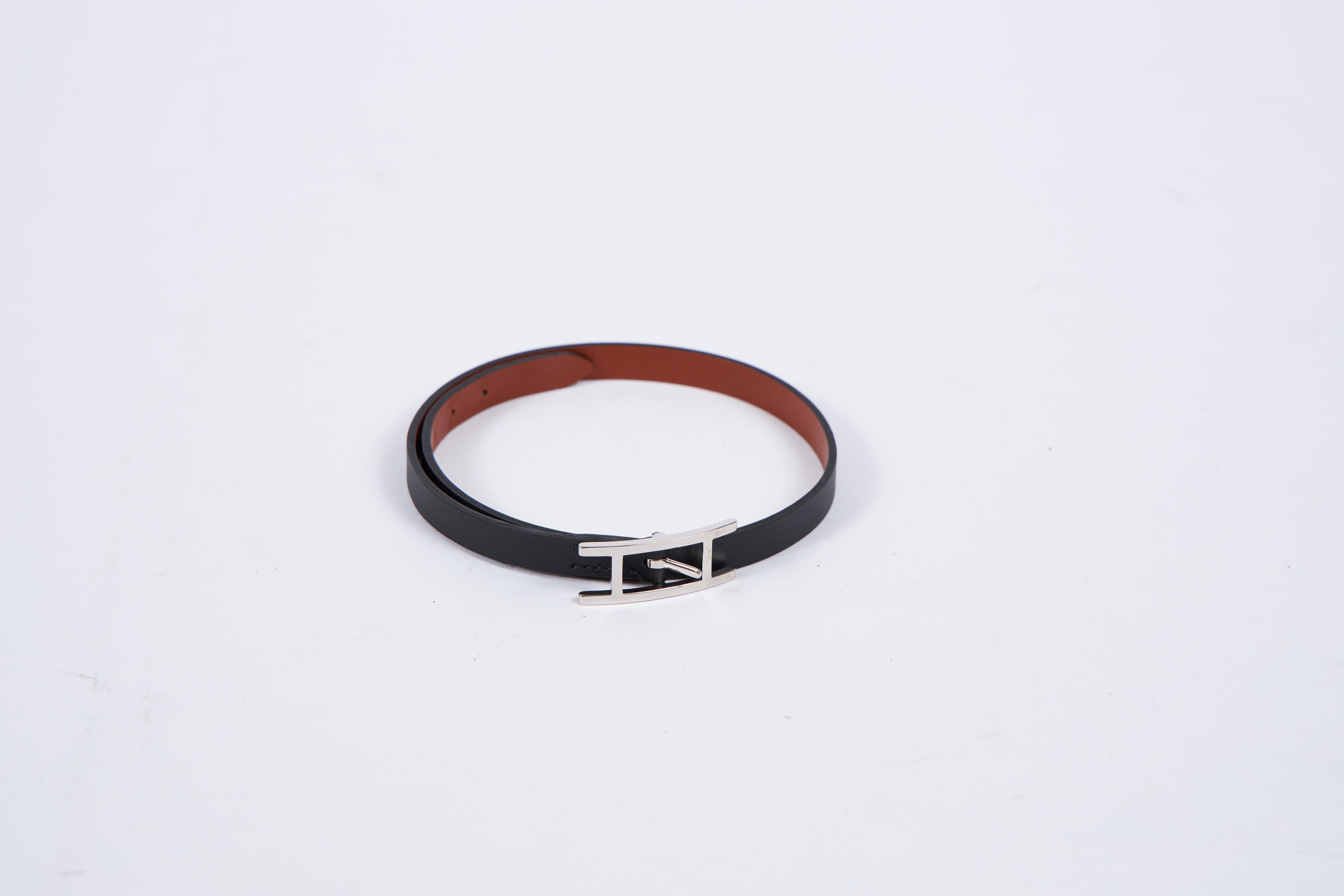 Hermes brand new in box black swift leather bracelet with palladium hardware. Size small. Comes with suede dust cover , original box and ribbon.