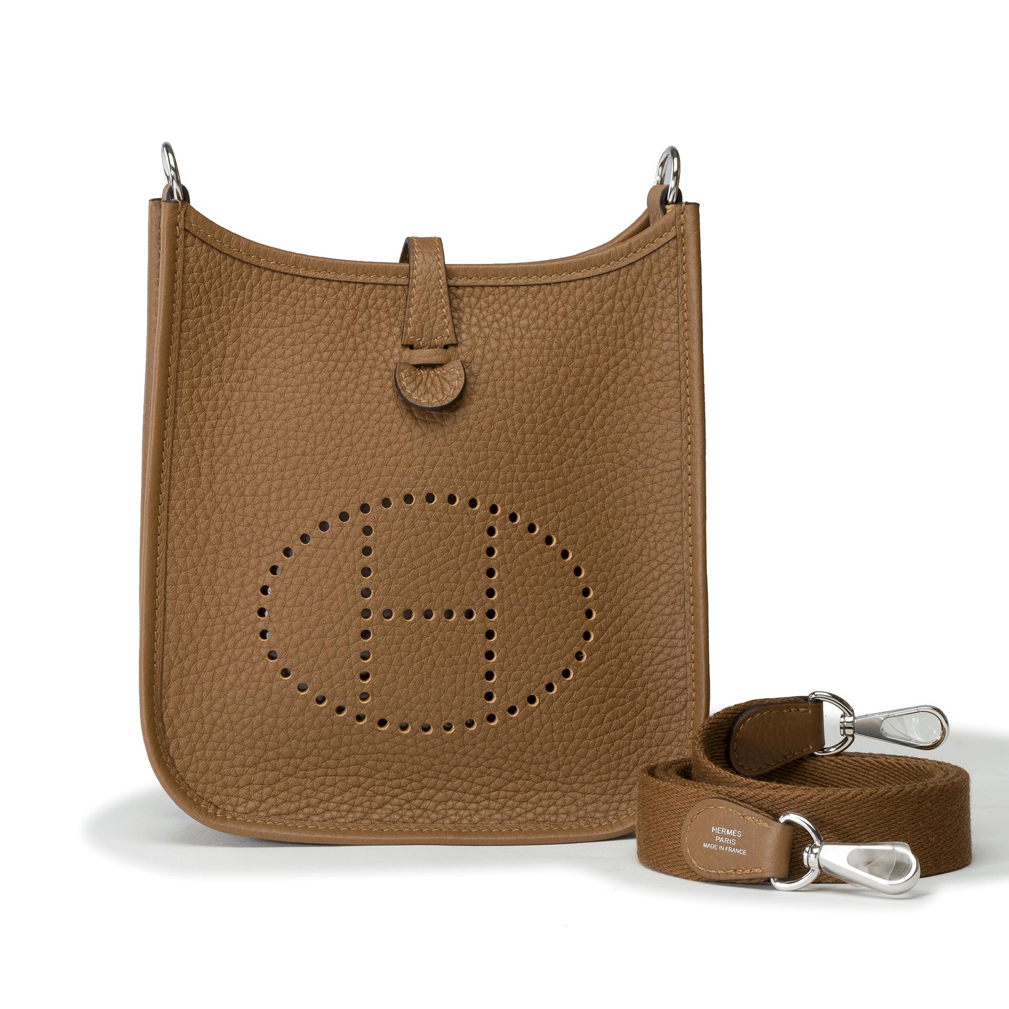Splendid​ ​Hermes​ ​Evelyne​ ​16​ ​TPM​ ​Amazone​ ​crossbody​ ​bag​ ​in​ ​Alezan​ ​Taurillon​ ​Clémence​ ​leather,​ ​silver-tone​ ​metal​ ​hardware,​ ​a​ ​removable​ ​brown​ ​canvas​ ​shoulder​ ​strap​ ​allowing​ ​for​ ​shoulder​ ​or​ ​crossbody​