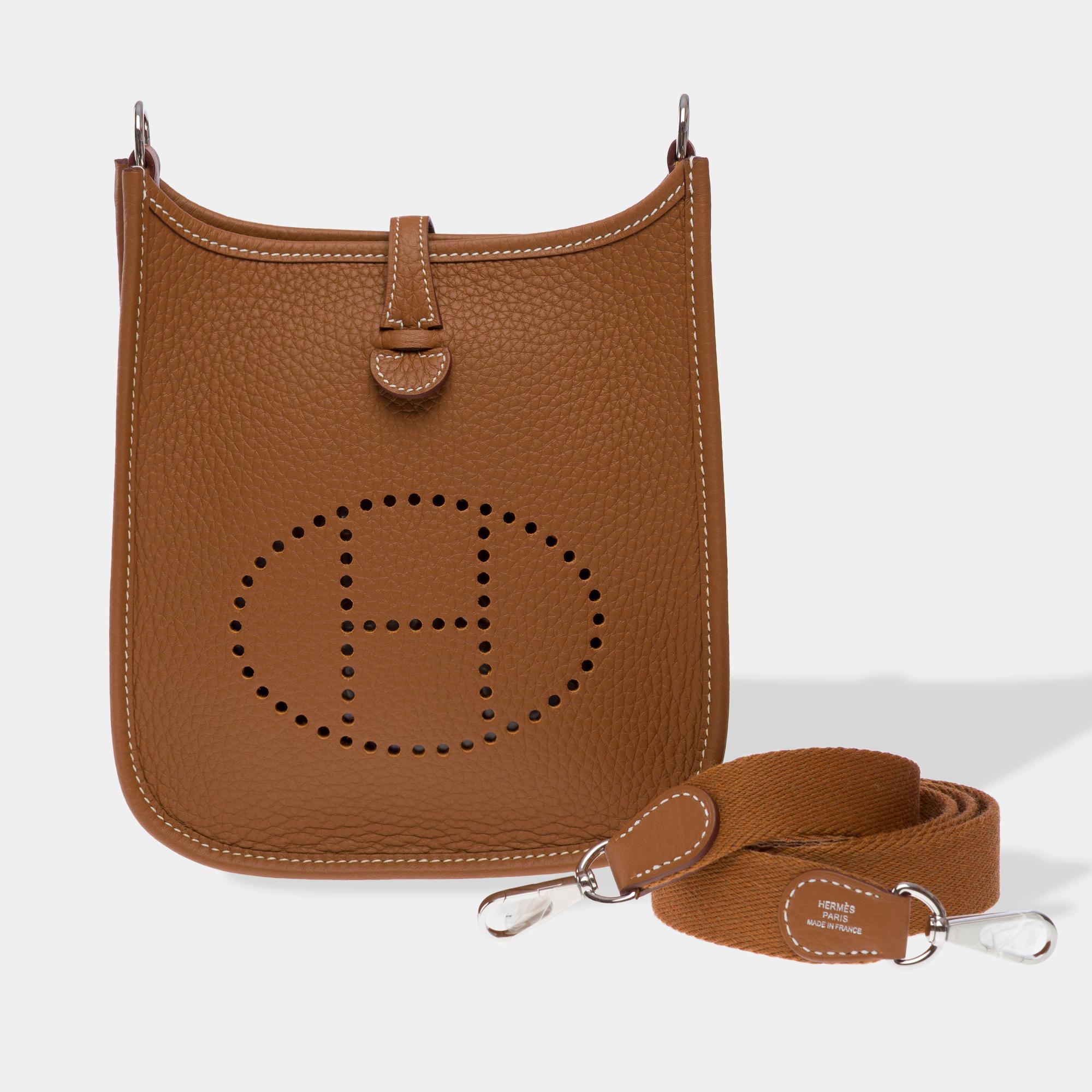 Beautiful​ ​Hermes​ ​Evelyne​ ​16​ ​TPM​ ​Amazone​ ​shoulder​ ​bag​ ​in​ ​Gold​ ​(Fauve)​ ​Taurillon​ ​Clémence​ ​leather,​ ​silver​ ​metal​ ​trim,​ ​a​ ​removable​ ​shoulder​ ​strap​ ​in​ ​Wooly​ ​gold​ ​canvas​ ​allowing​ ​a​ ​shoulder​ ​or​