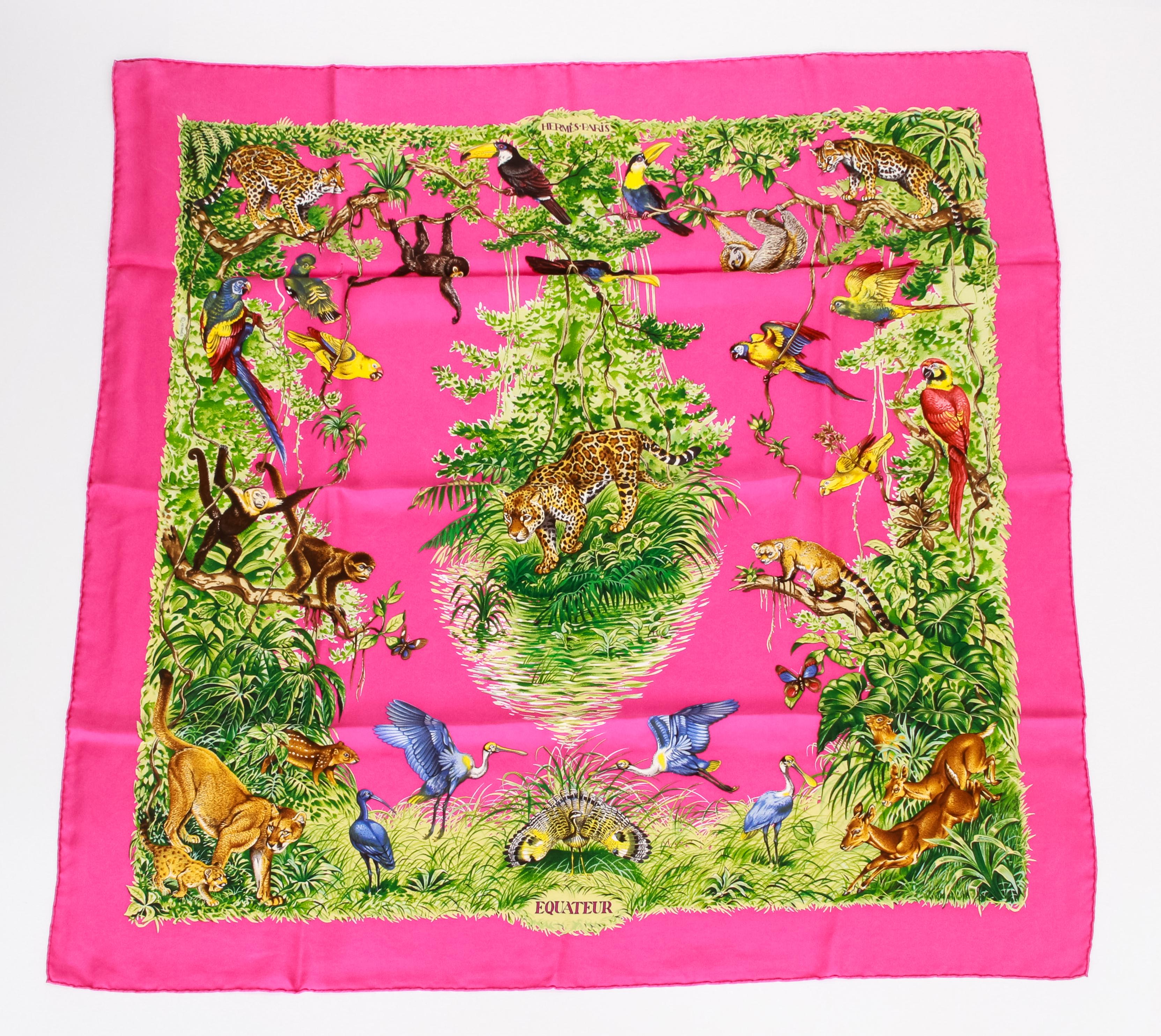 Hermès silk Equateur scarf designed by Robert Dallet. Fuchsia and green colorway with hand-rolled edges. Washed silk. Brand new in original box.